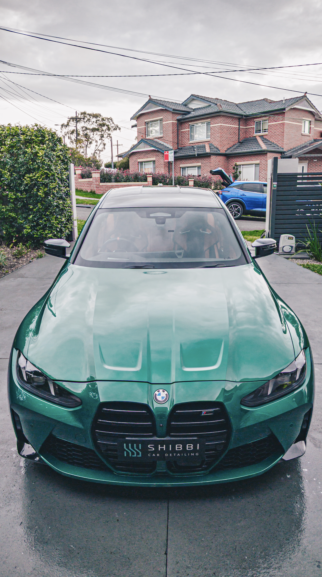 Shibbi Car Detail mobile car detailing completed a full exterior detail on this green BMW M3 G80 including paint correction and ceramic coating, resulting in a deep wet mirror gloss in a customer's driveway in Rose Bay, Sydney.