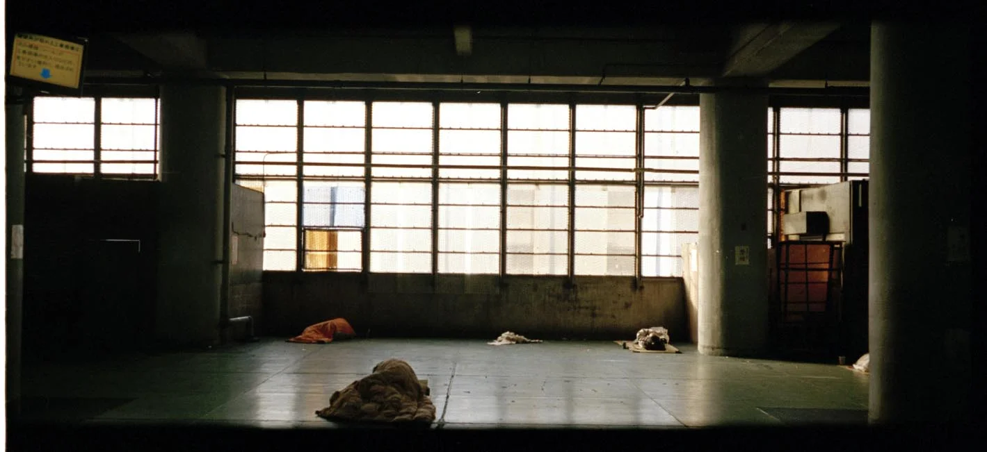 inside bus shelter- sleeping men.jpg
