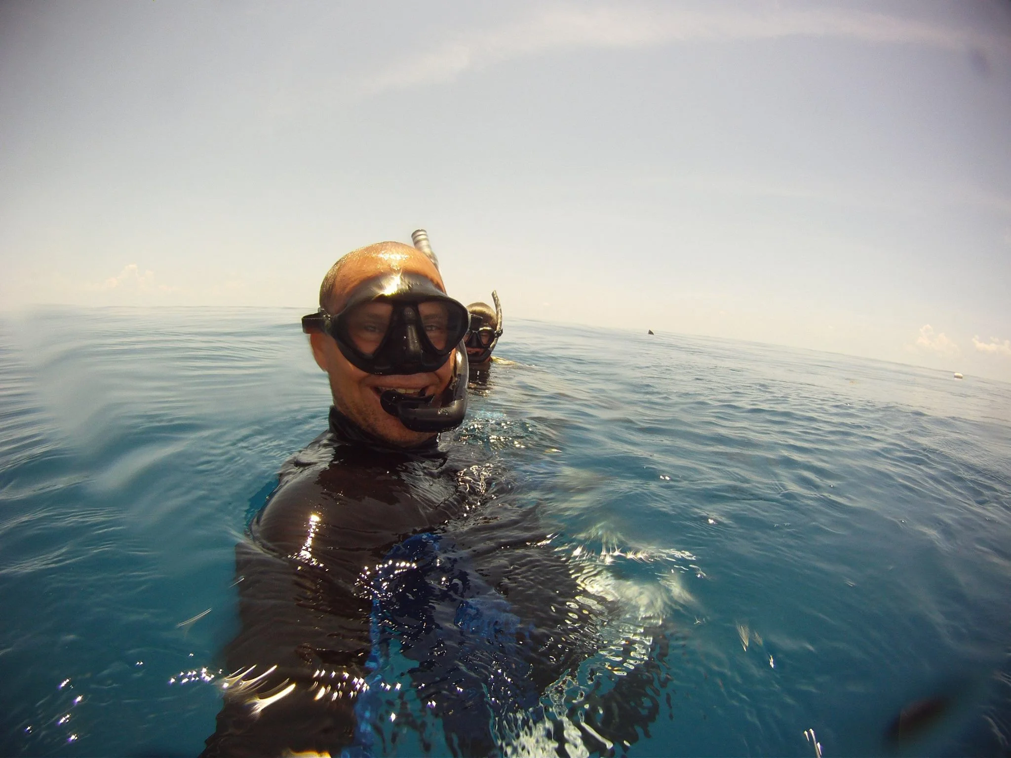 rob bond smiling at the surface after another successful day on the water in key west.