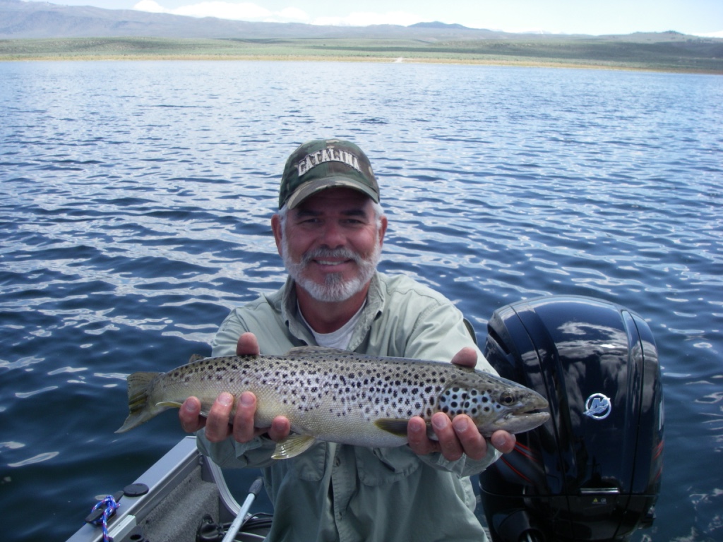 Bishop fly fisher Jim Campbell holds a trophy brown trout he caught midging in 20 feet of water off of North Landing.