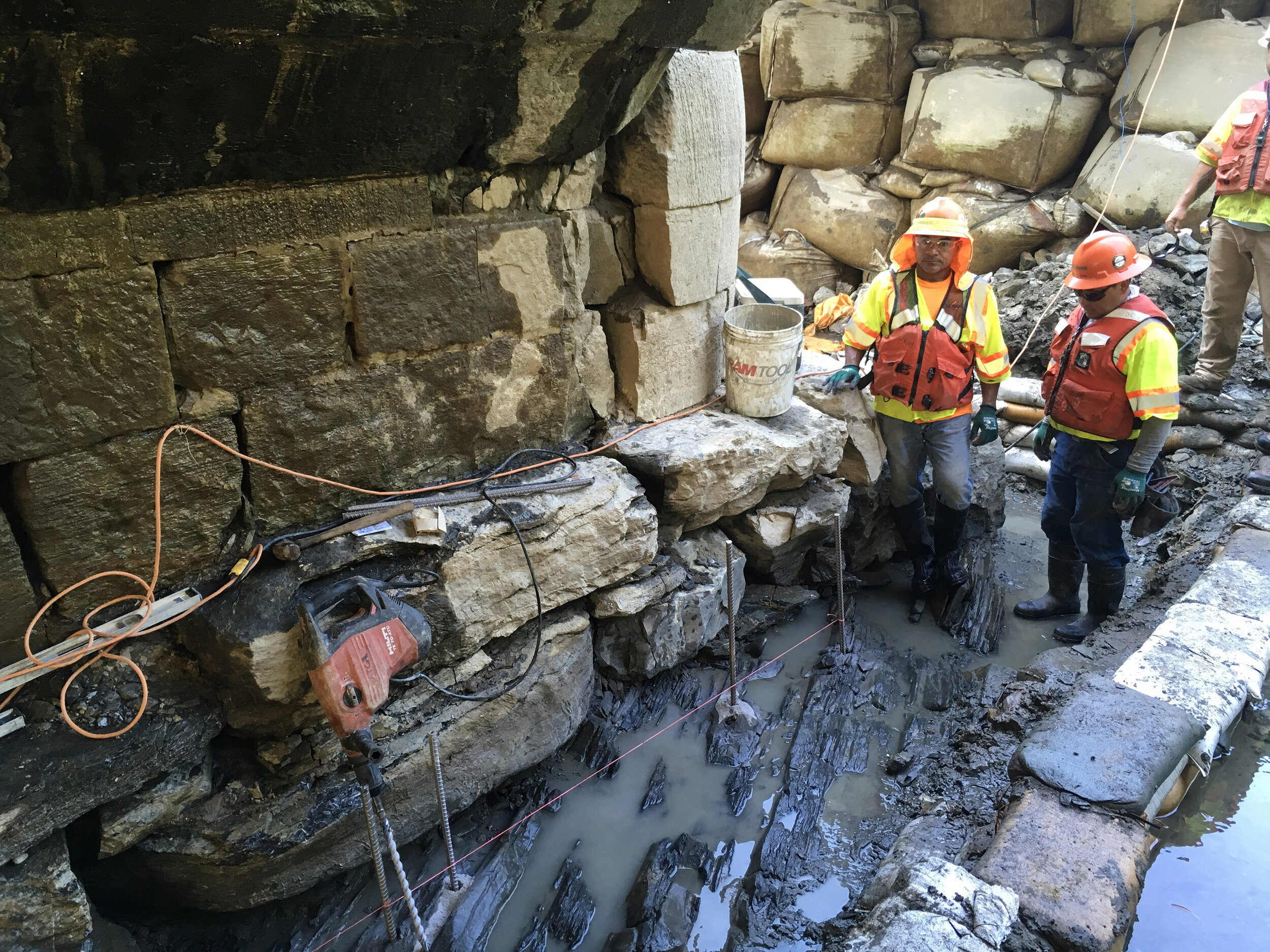 During: Sediment Removal + Preparation for Concrete Wraps