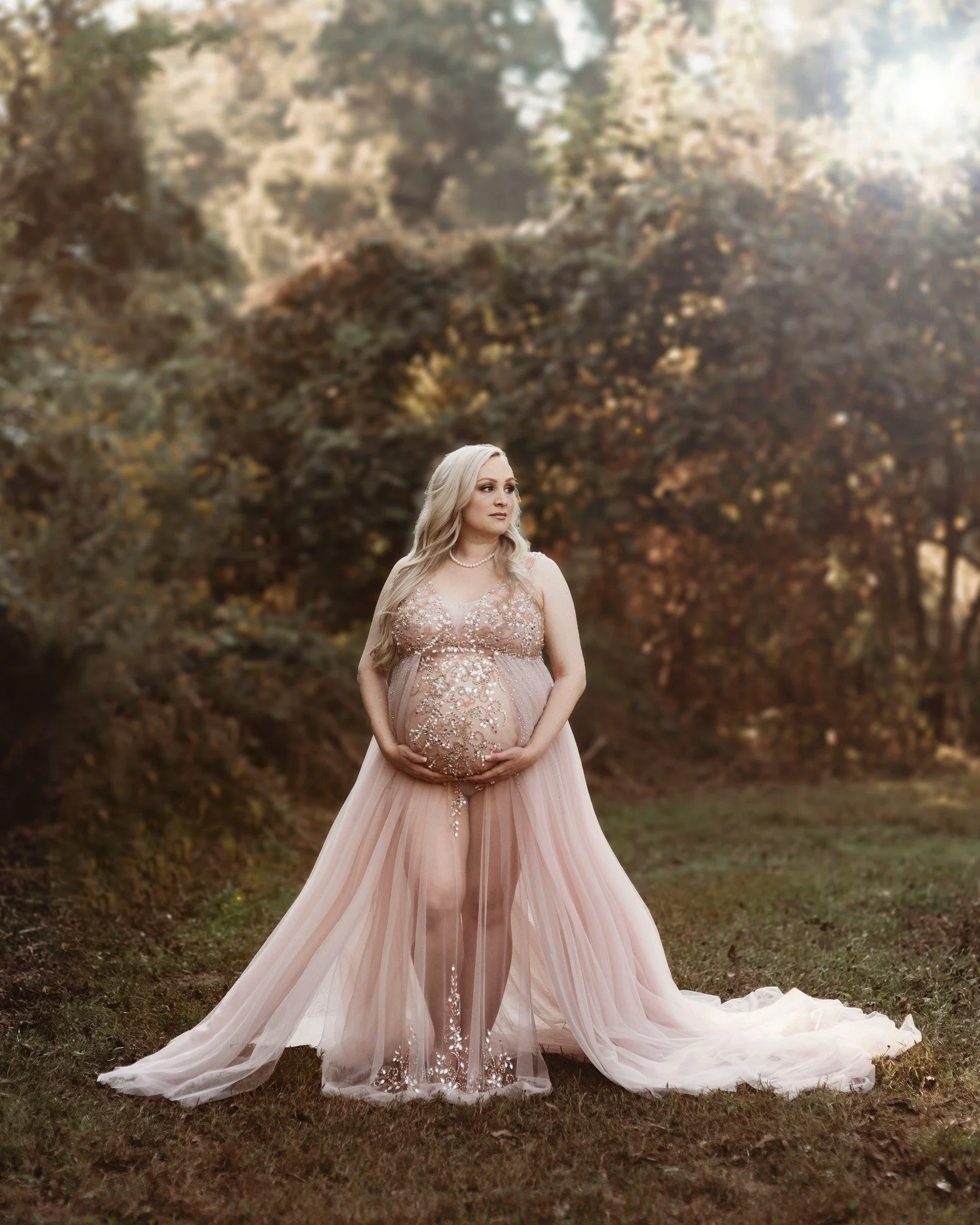 This will always be one of the most popular gowns in our client closet. We have 100+ and a variety to choose from. You can decide on several plus studio shots as well. We will go over outfits while you get your makeup and hair done. Everything is tak