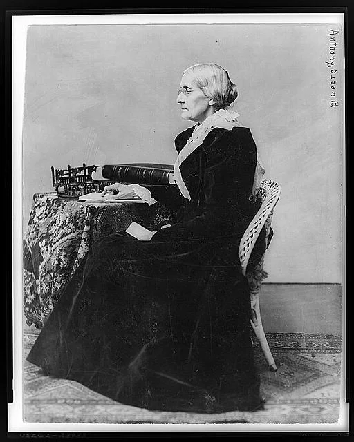 Susan B. Anthony, full-length portrait, seated, facing left