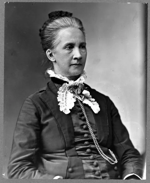 Lawyer Belva Lockwood, half-length portrait, seated, facing right
