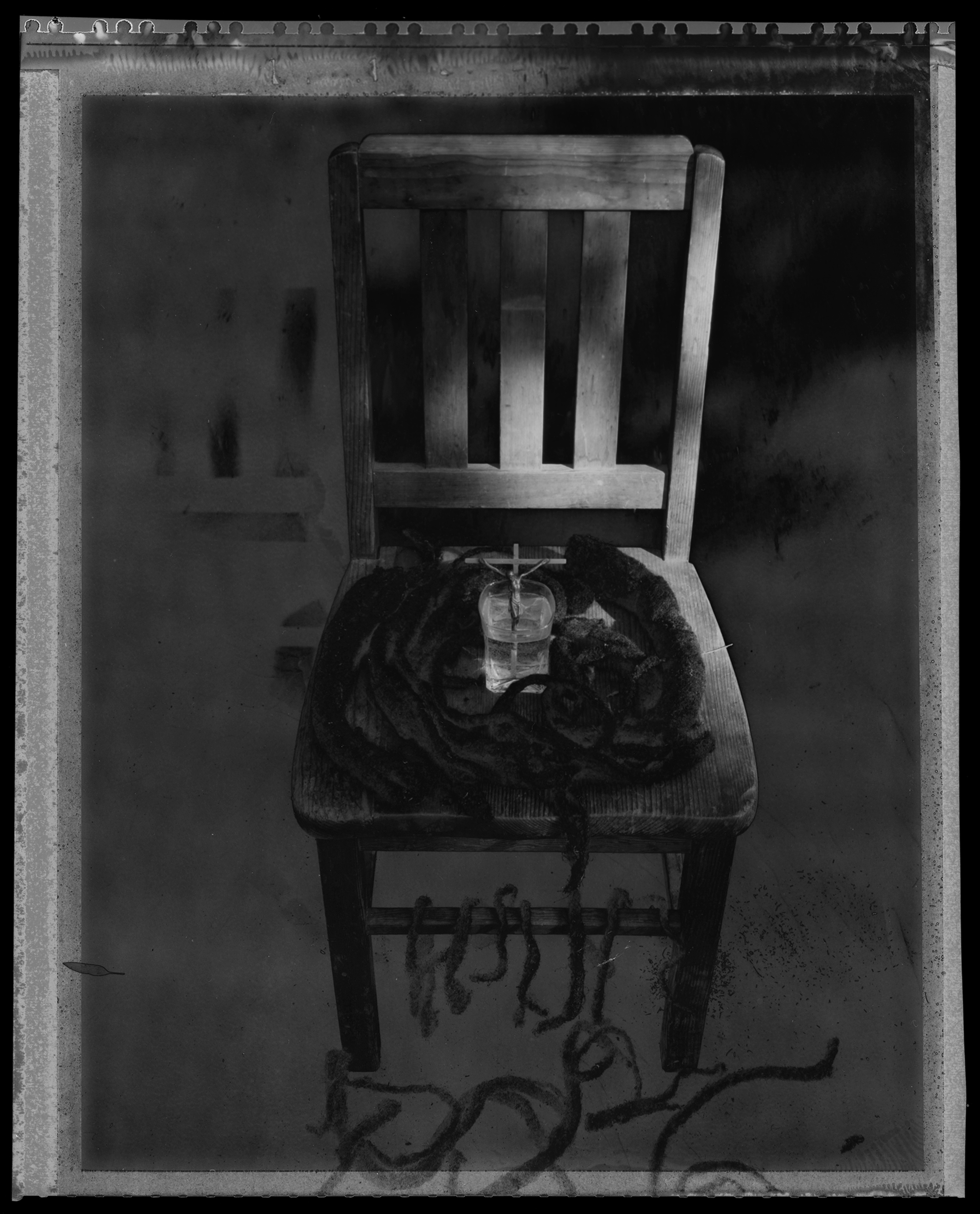 Untitled Throne With Crucifix, Water, &  Shorn Dreadlocks, 1990