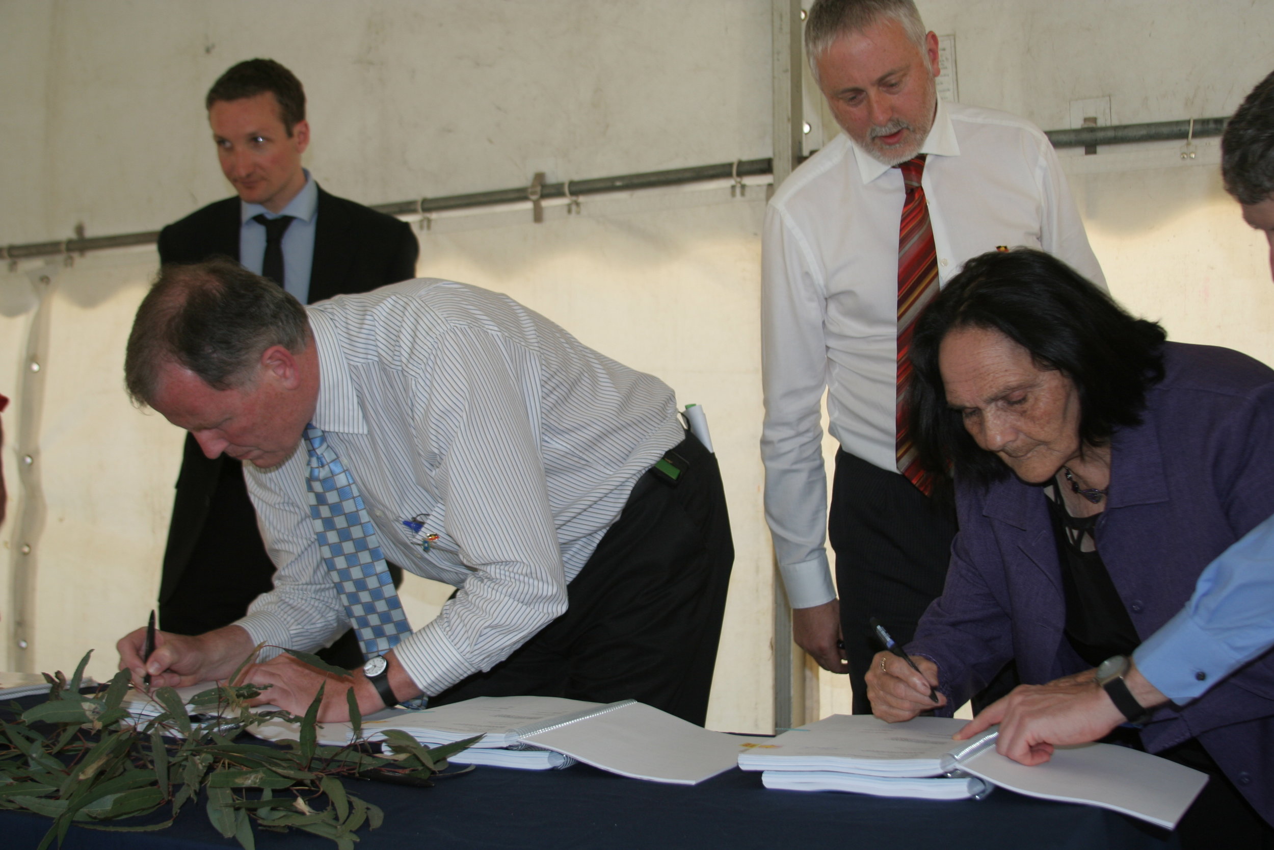 Deputy Premier and AG Rob Hulls signs Recognition & Settlement agreement, Minister Gavin Jennings behind. AUnty Gwen Atkinson signs - by TC.JPG