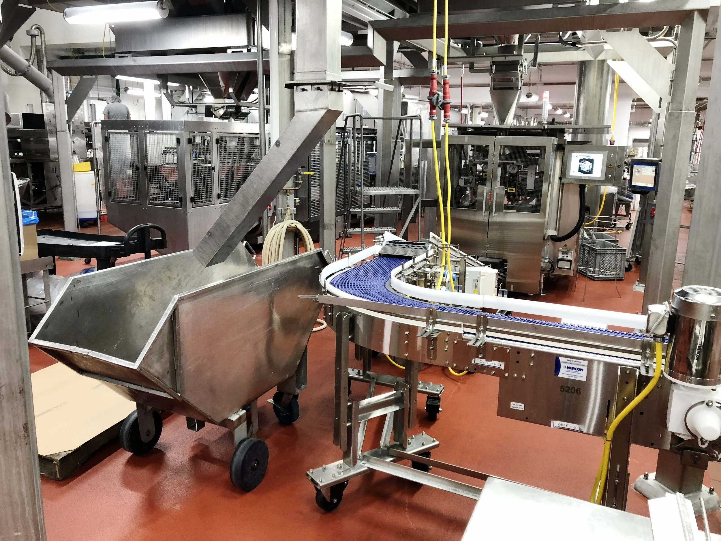  While using certain conveyor configurations, as shown in the photo above, the conveyors would impede with cart placement and wouldn’t allow for proper collection. With the addition of small pins welded to the chute, the angled chute can be removed a