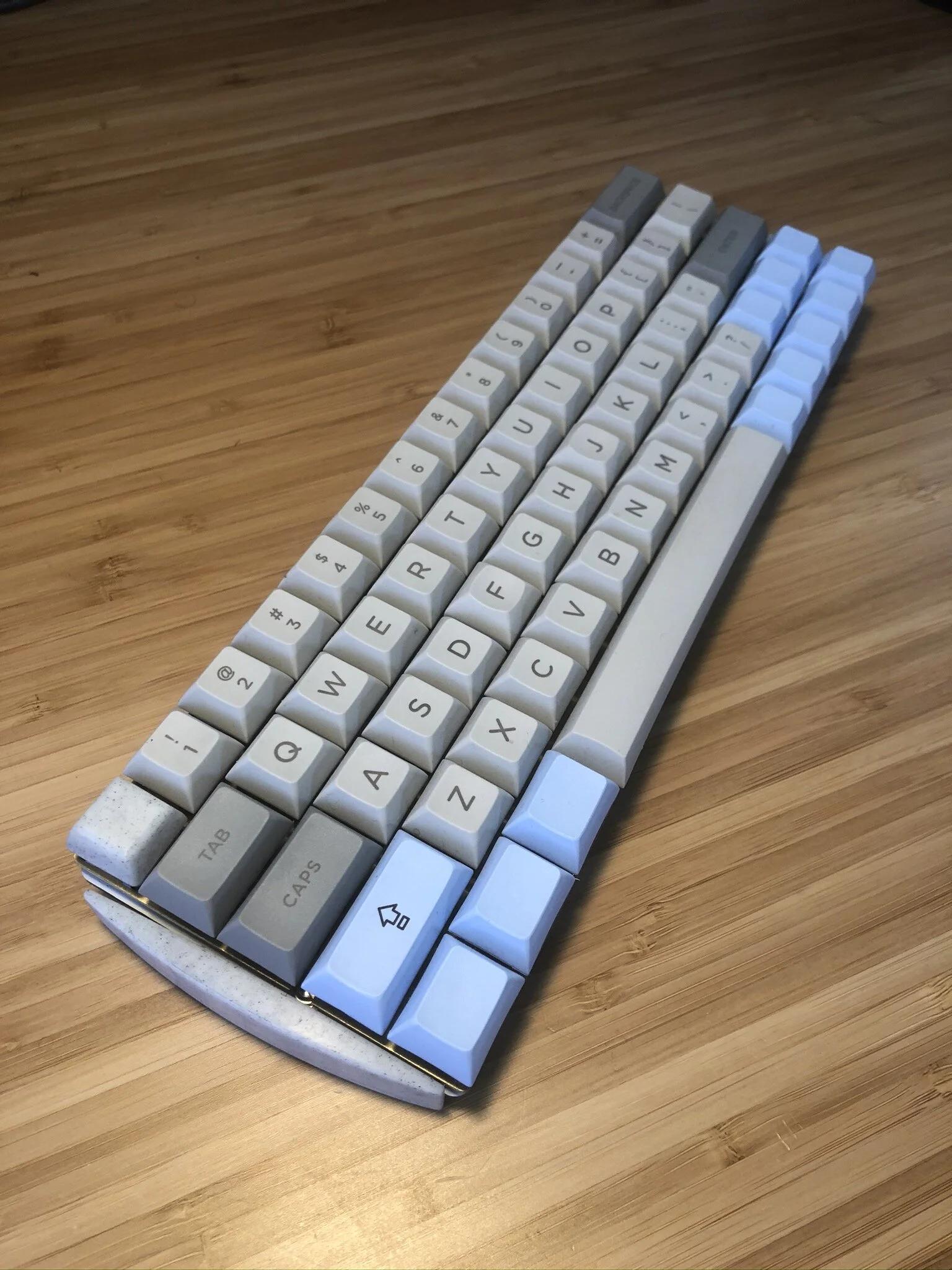  I chose a modified 60% layout because the 100% and ten-key-less layouts always seemed bulky to me, and I never found myself using all of the keys on those keyboards. Through the use of layers, I still have full access to all of my function keys and 