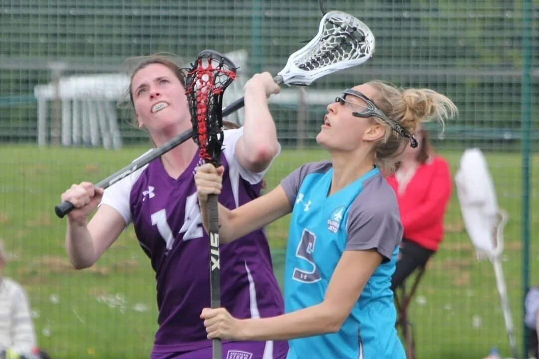 Women playing lacrosse