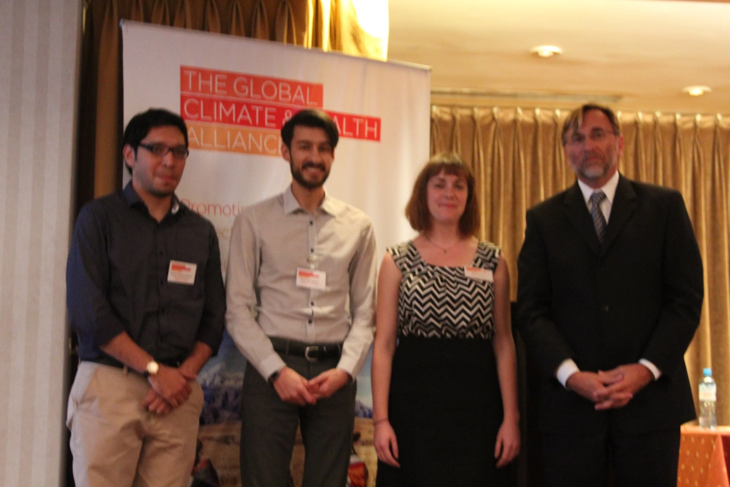 IMG_6099-poster-and-presentation-winners-with-organizer.jpg