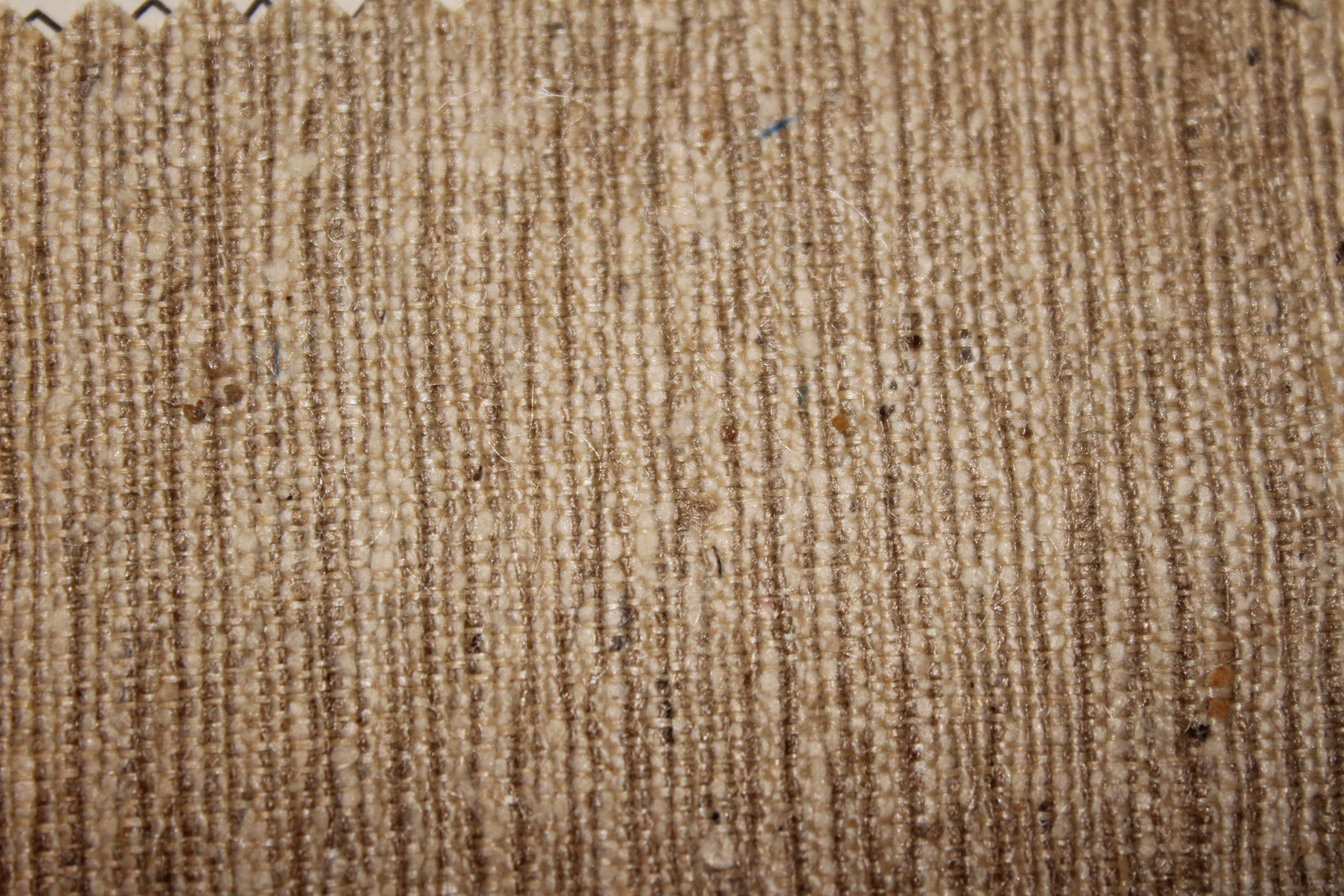 Tussah silk typically has a rougher texture, although not always this rough. The brownish to cream color is also typical of Tussah silk.