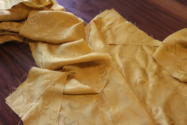 Gore/gusset combo on top of sleeve, right sides together, with gusset extending along side of sleeves.