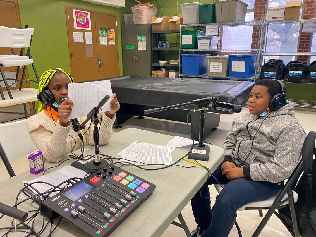 Image of two children recording a podcast at a BCRP Farring-Baybrook Recreation Center rec center