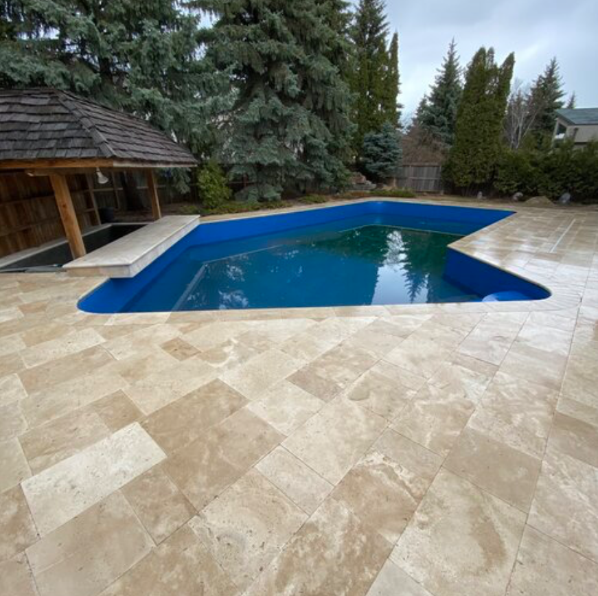 winnipeg-travertine-pool-deck-with-bar.jpg