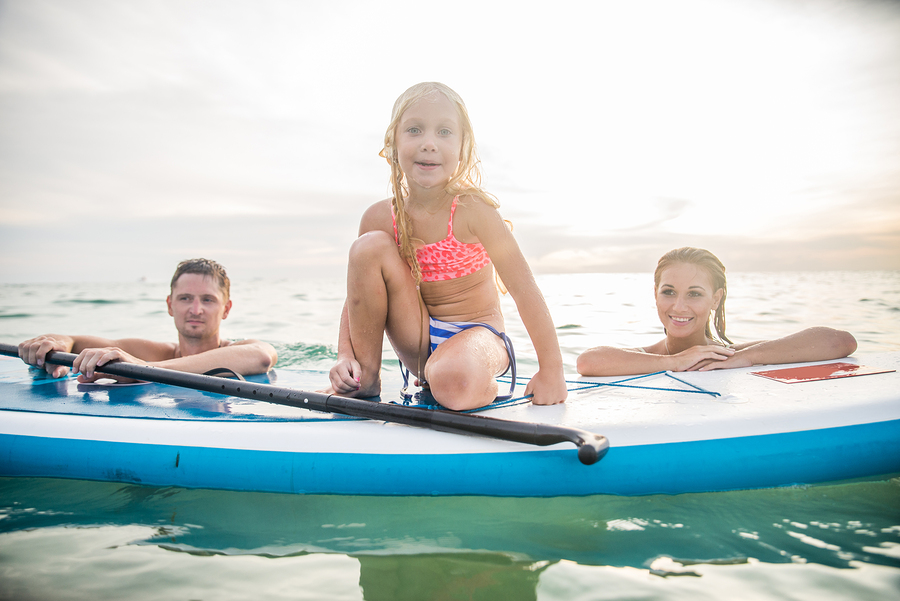 bigstock-Family-With-Paddle-Board-93911435.jpg