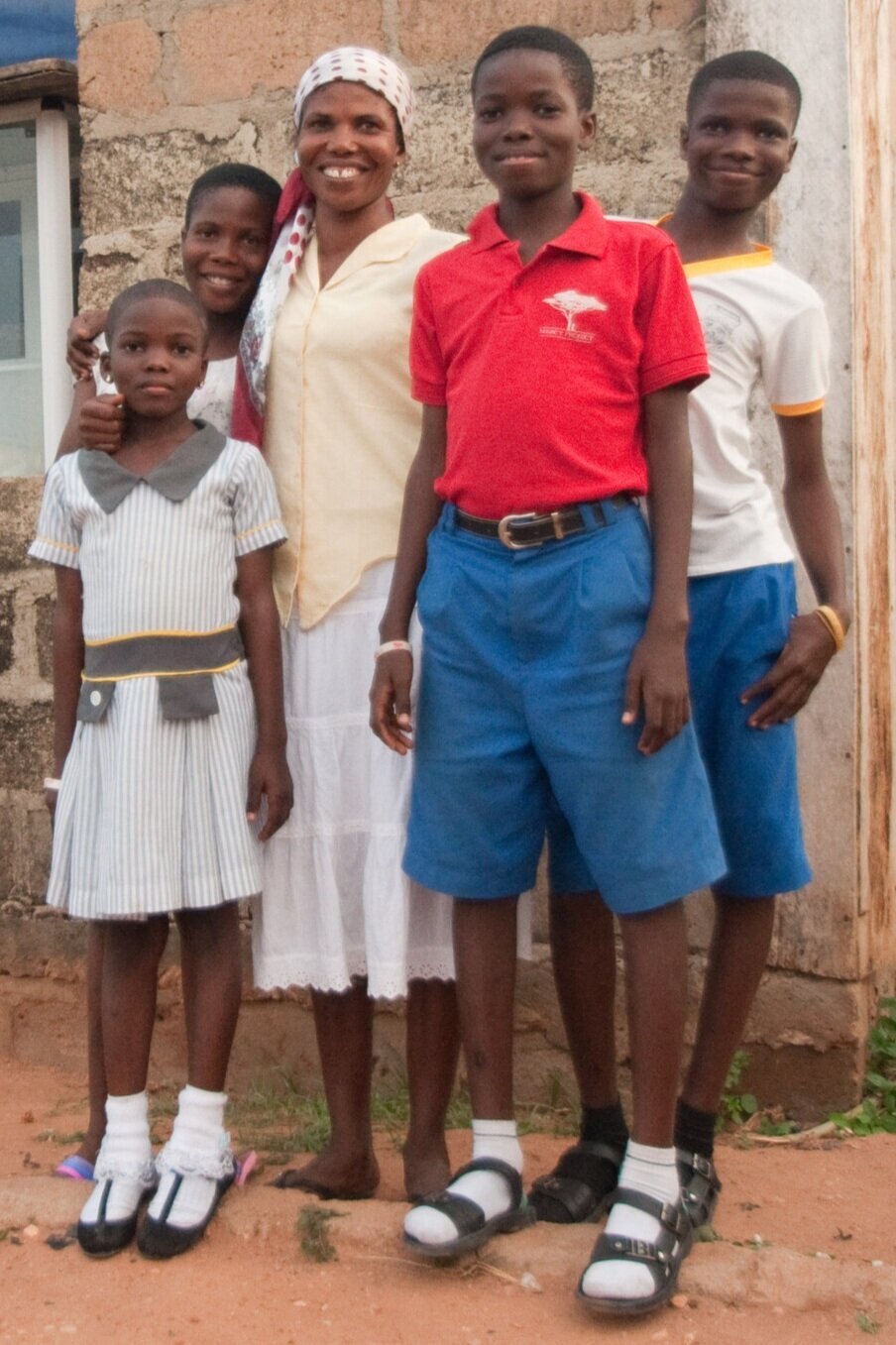  Clifford with family outside mother’s shop, 2016 