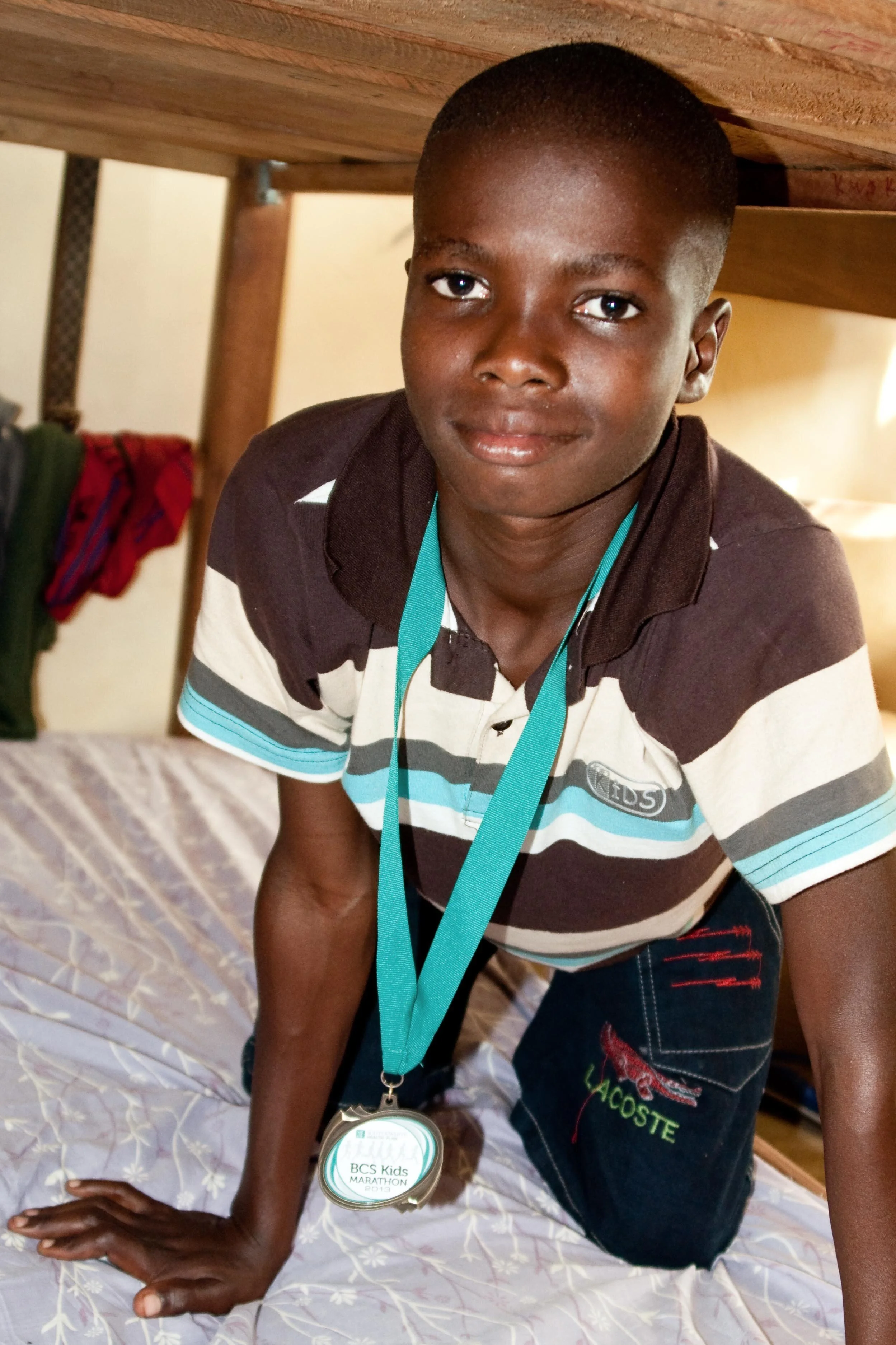 Philip at shelter on his new bed, 2014