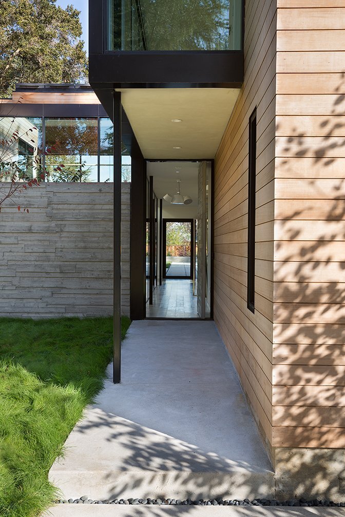 a-string-of-glass-hallways-connect-the-four-pavilions-bringing-a-slice-of-the-great-outdoors-inside.jpg