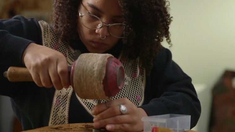 Cassie Jones, working on one of her artisan leather products.