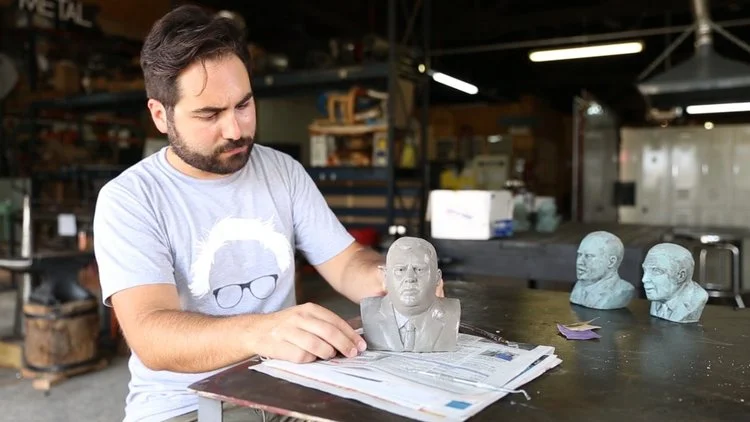 Jim Dessicino observes a bust he's made of New Jersey governor, Chris Christie.