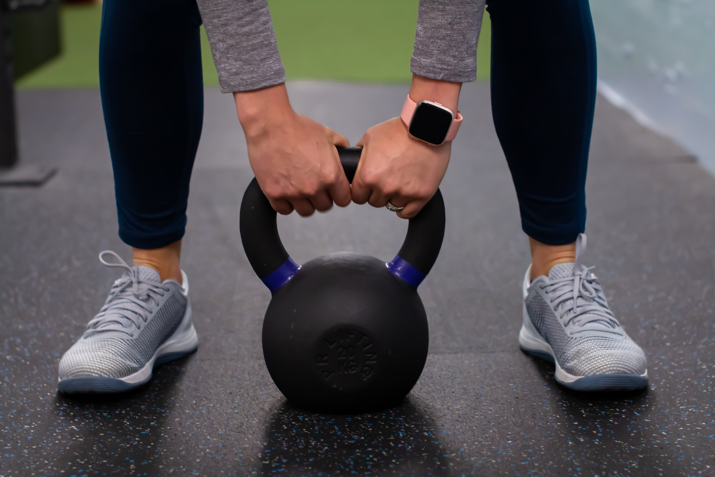 Patient lifting a kettle bell