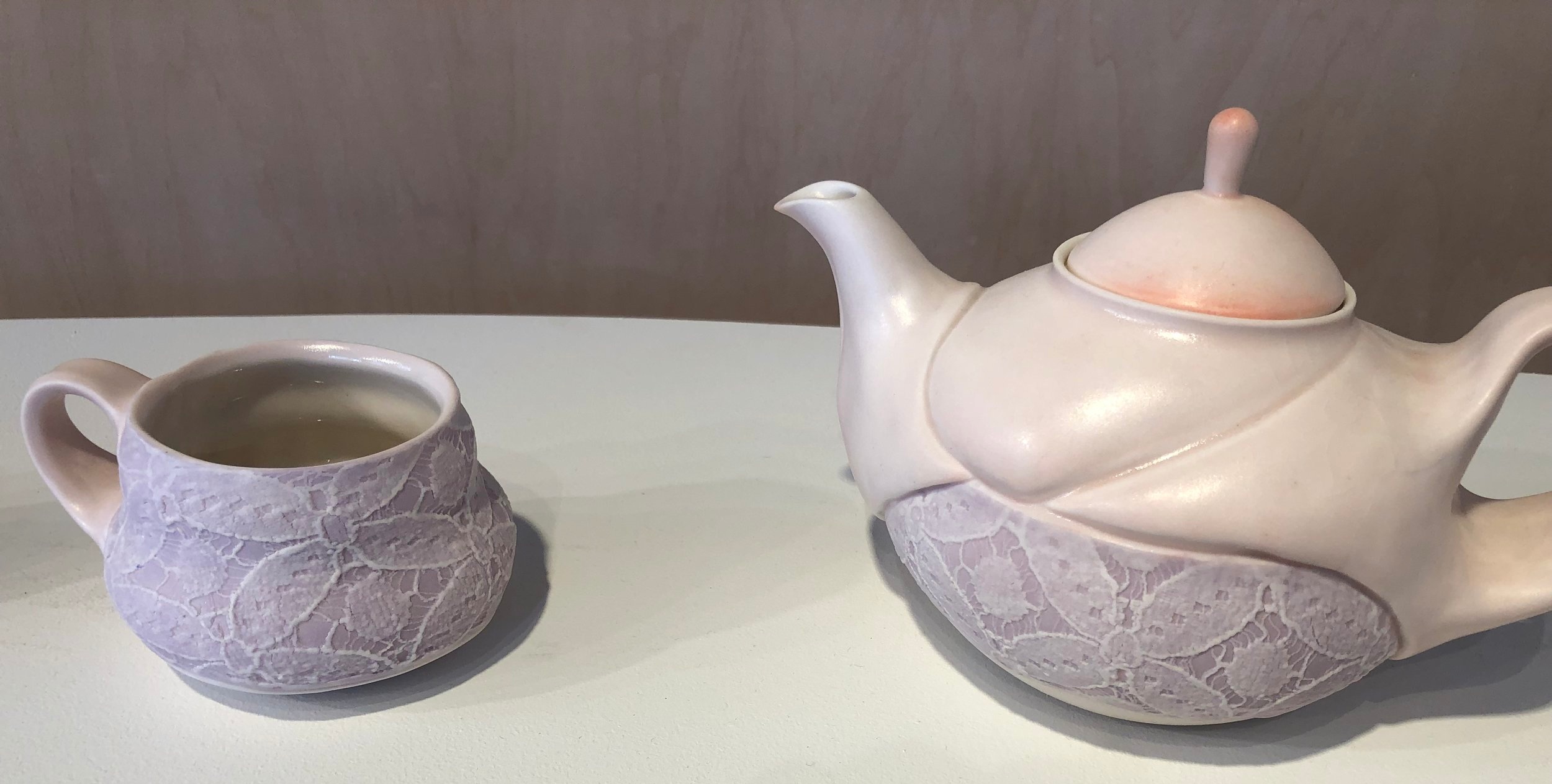 exhibition of samantha briegel ’s work, included these ceramics topped with lace.