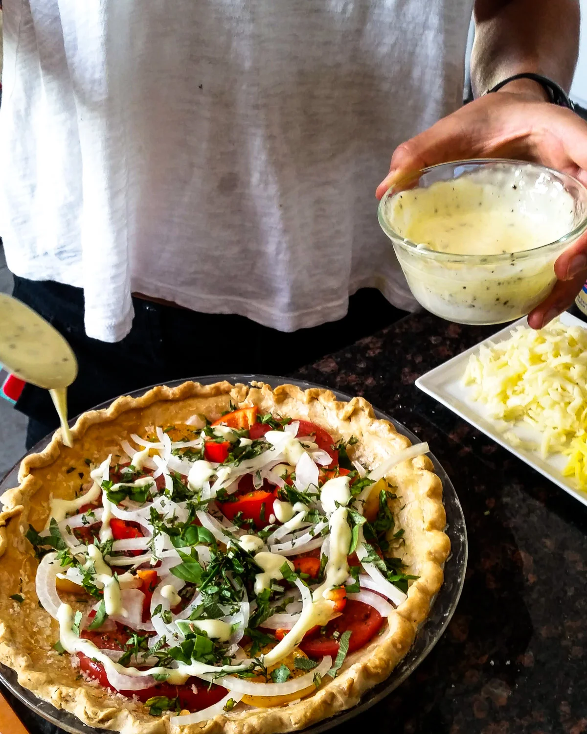 Adding mayonaise.