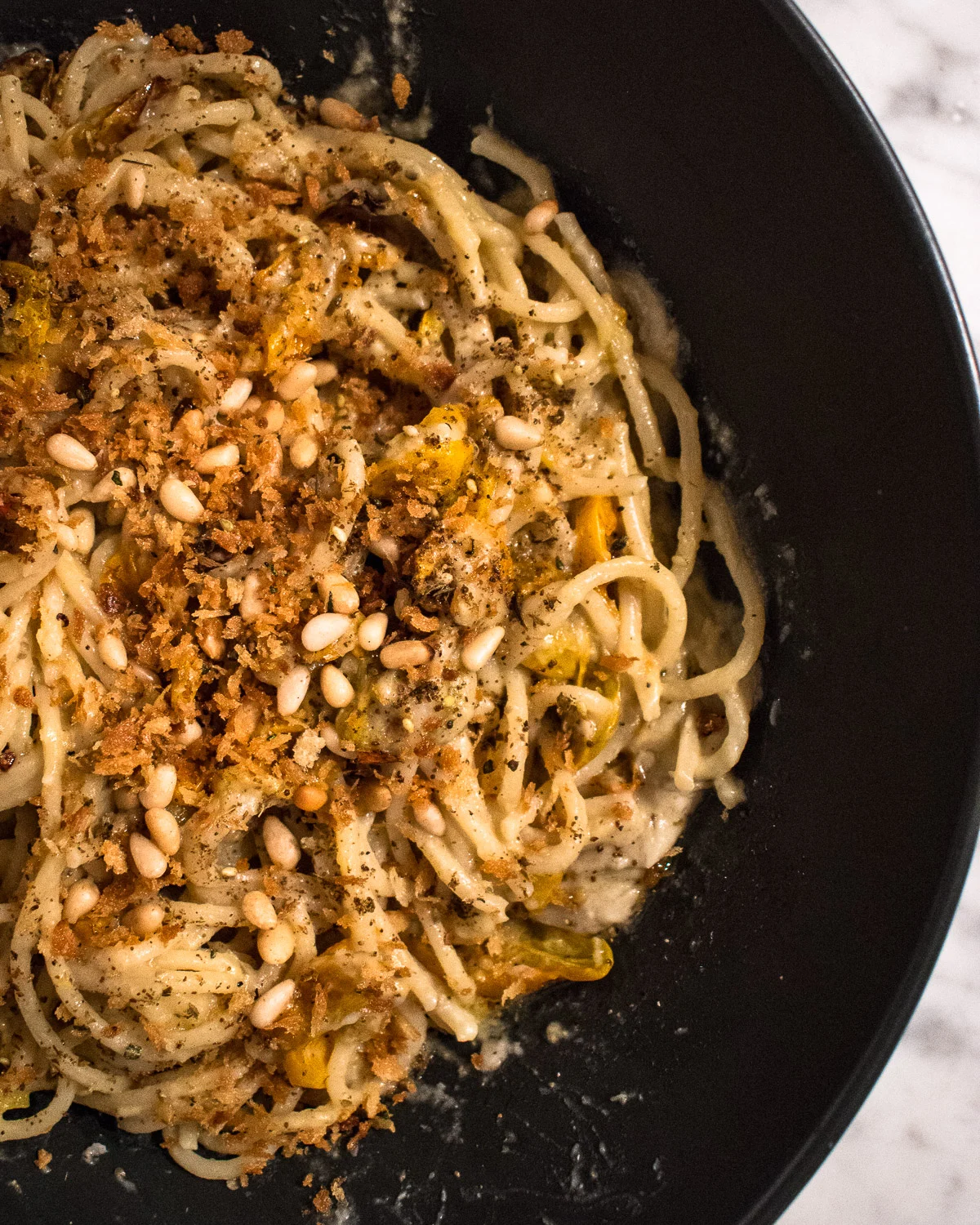 Herbed bread crumbs, toasted pine nuts and za’atar garnish the Roasted Eggplant and Cherry Tomato Pasta.