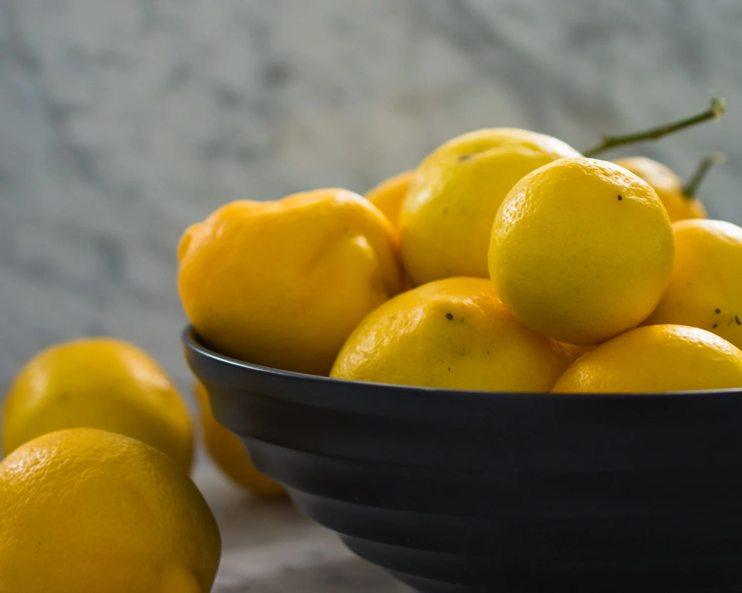A bowl of fresh Meyer lemons.