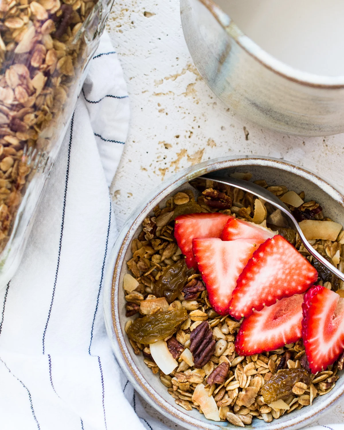Lemon pecan granola topped with fresh California strawberries.