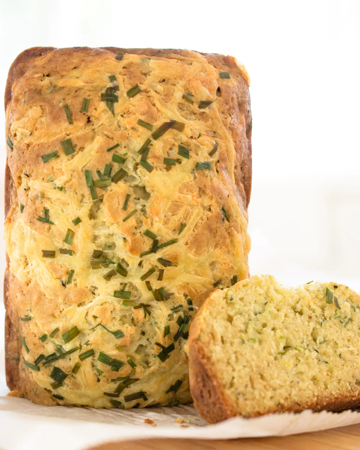 Cheesy Zucchini Bread topped with chives.