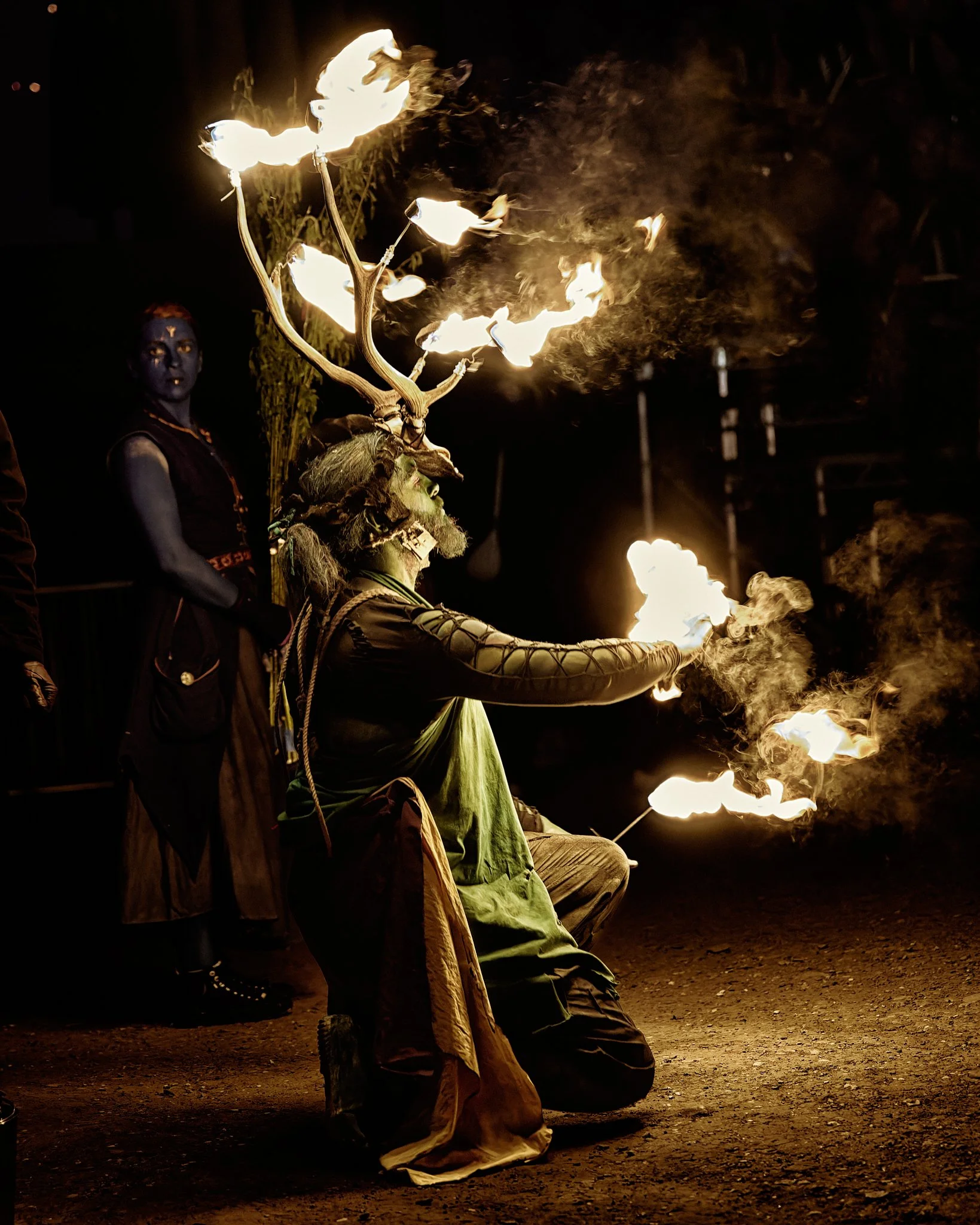 This documentary fieldwork photograph shows the Winter Green Man in flames. He must burn for the Summer Green Man to be reborn. Beltane, Edinburgh 2026