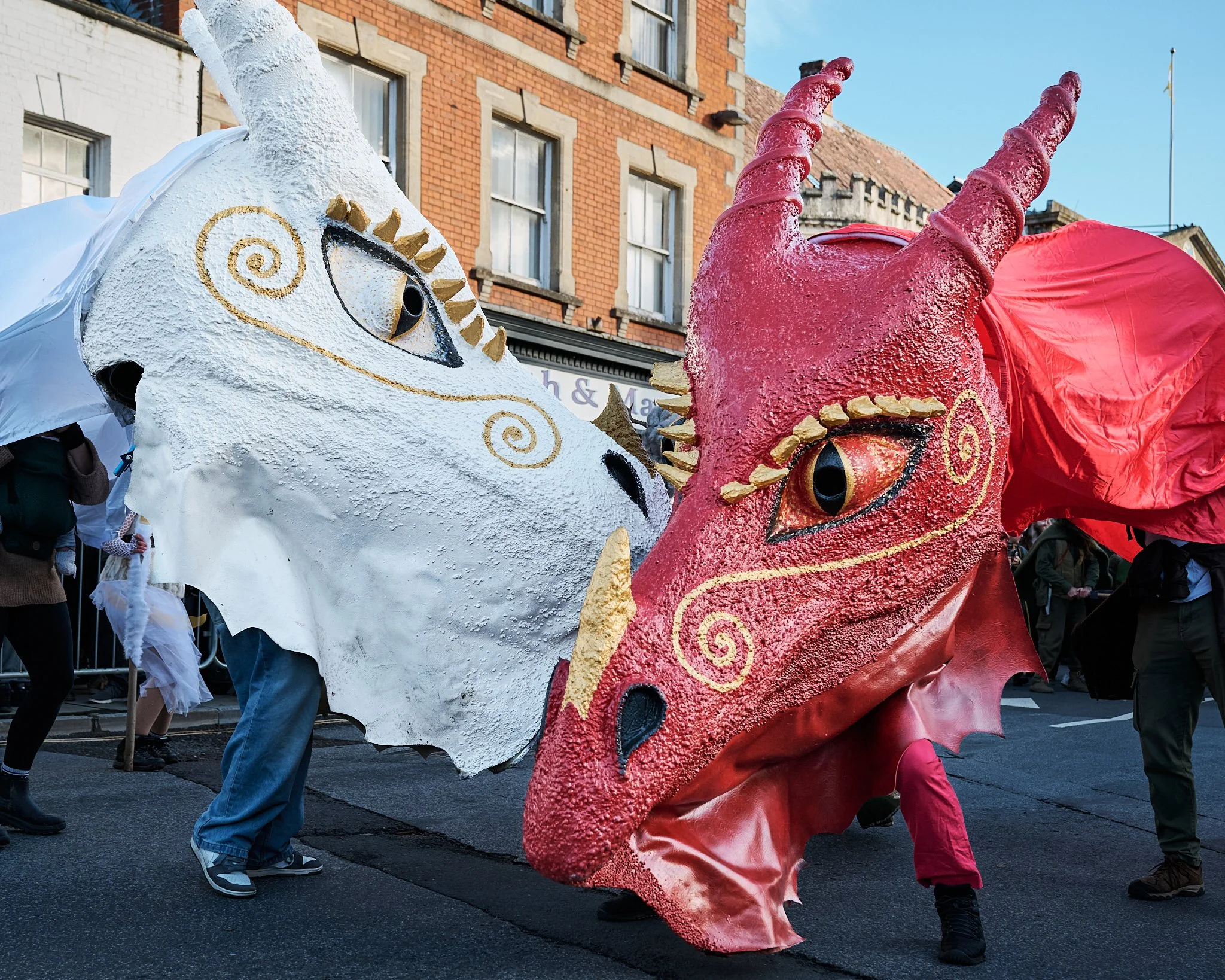 Documentary fieldwork photograph of Celtic Samhain Wild Hunt in Glastonbury, showing the White and Red dragon battle