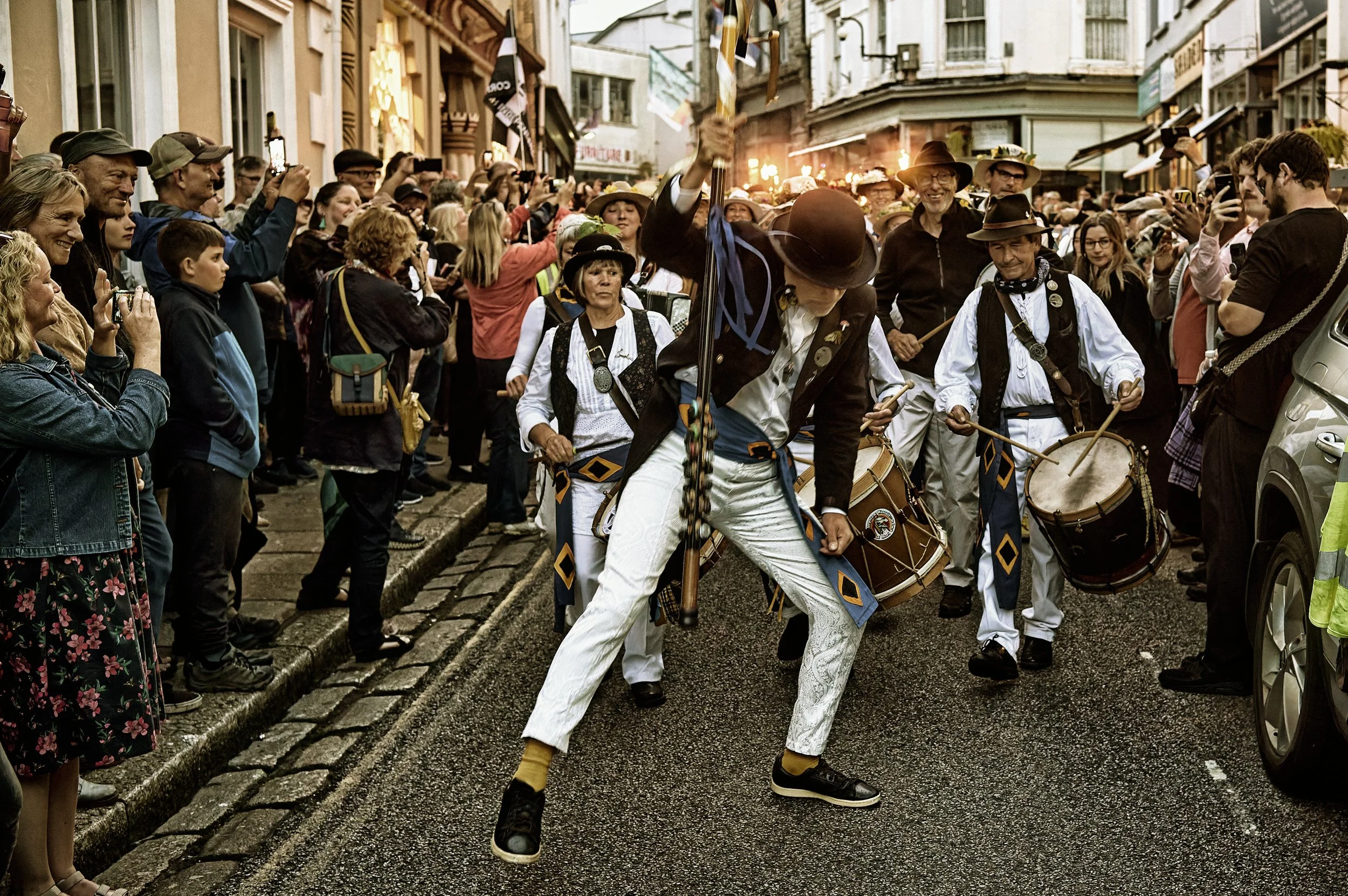Documentary fieldwork photograph of Golowan Torch Lit parade in Penzance showing the Master of Ceremonies in dance