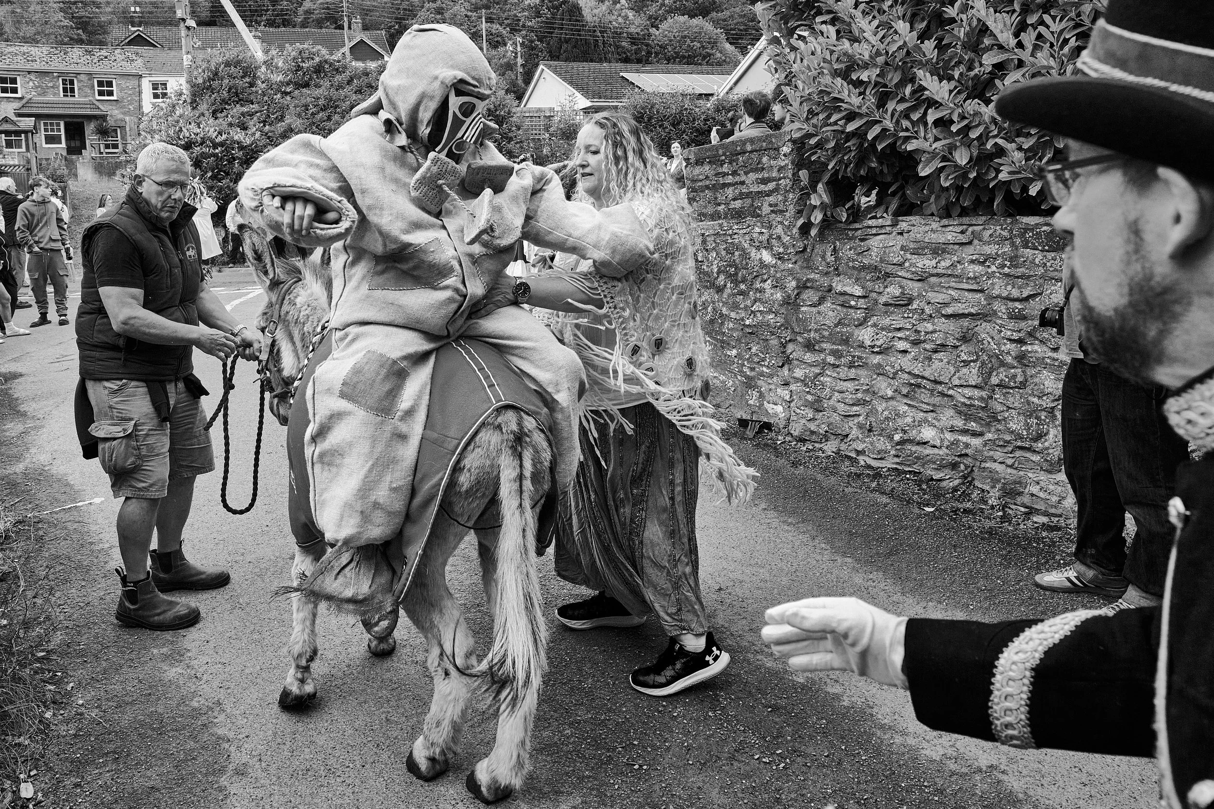 Documentary fieldwork photograph of Hunting the Earl of Rone in Coombe Martin, showing the Earl of Rone paraded backwards on a donkey