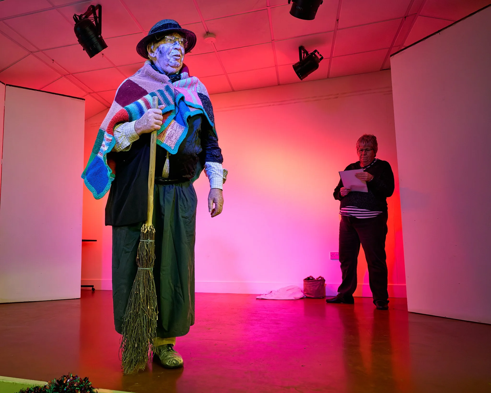 Documentary fieldwork photograph of The Hoodeners in Monkon Village Hall, showing The Molly engaging the audience