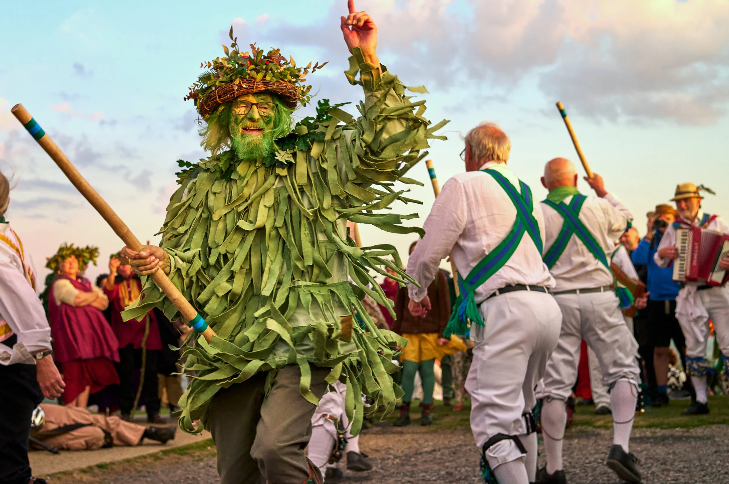 Documentary fieldwork photograph of Beltane in Glastonbury Tor, showing The Green Man and Morris Dancers