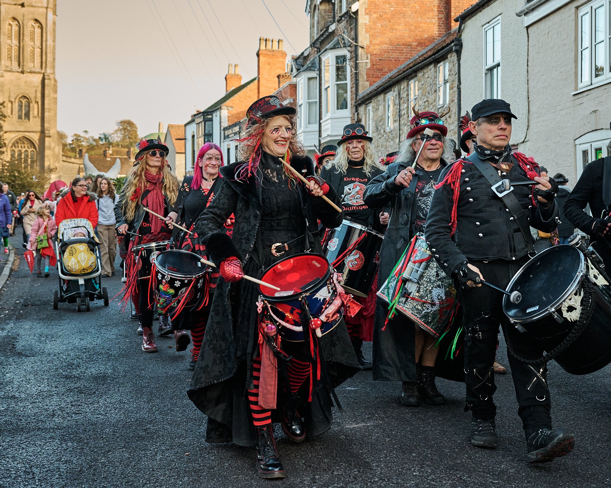 Documentary fieldwork photograph of Celtic Samhain Wild Hunt in Glastonbury, showing the Glastonbury Dragons band