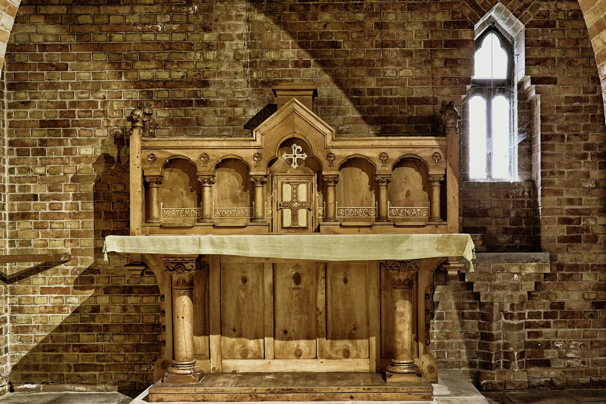 This documentary fieldwork photograph is of the wooden altar dedicated to Saint Paul. It is from Appuldurcombe's former wooden church, now residing in Pilgrim Chapel at the New Quarr Abbey