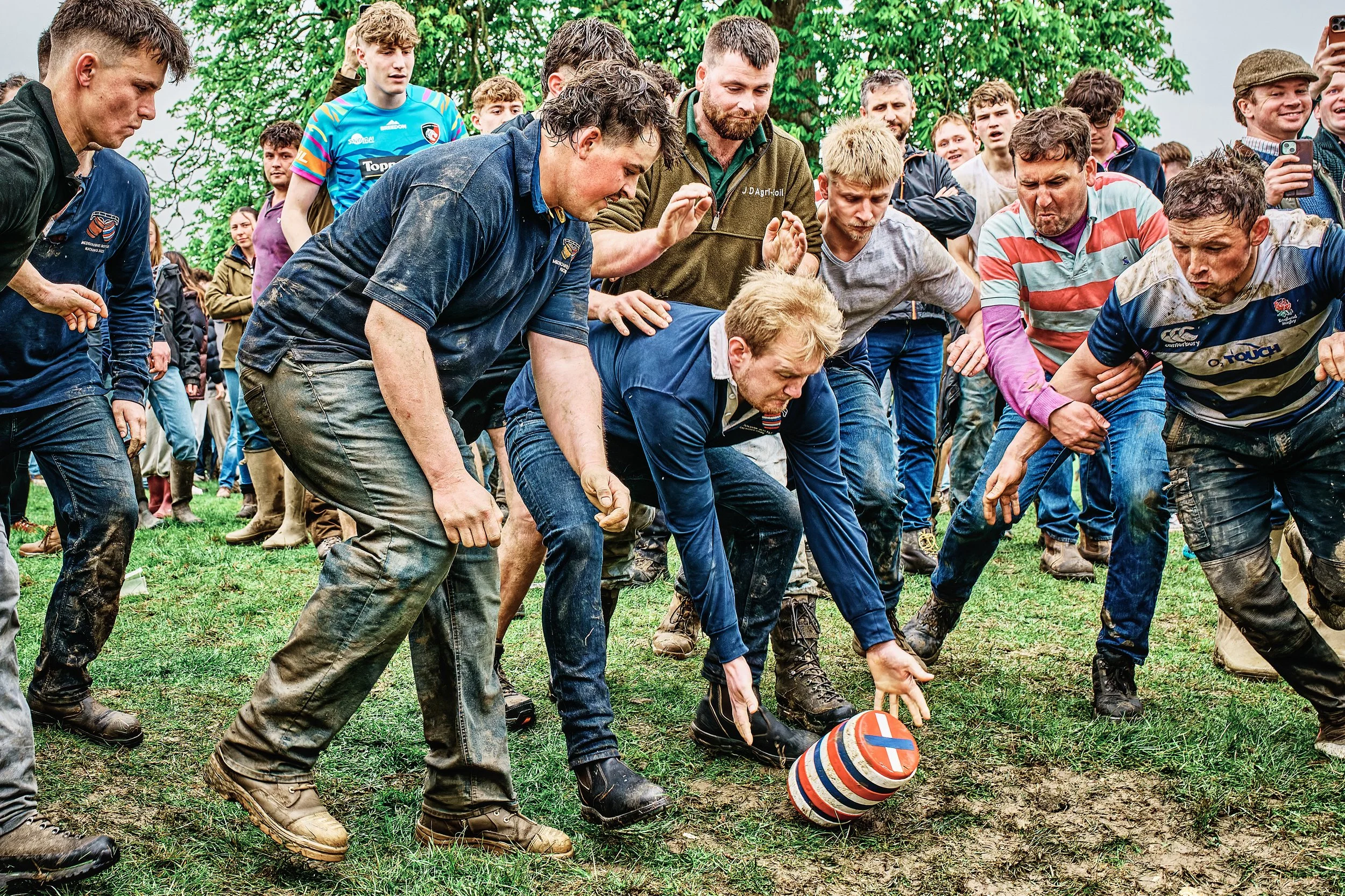 Documentary fieldwork photograph of the ancient Hare Pie and Bottle Kicking Event in Hallaton, showing the Bottle Kicking kick-off