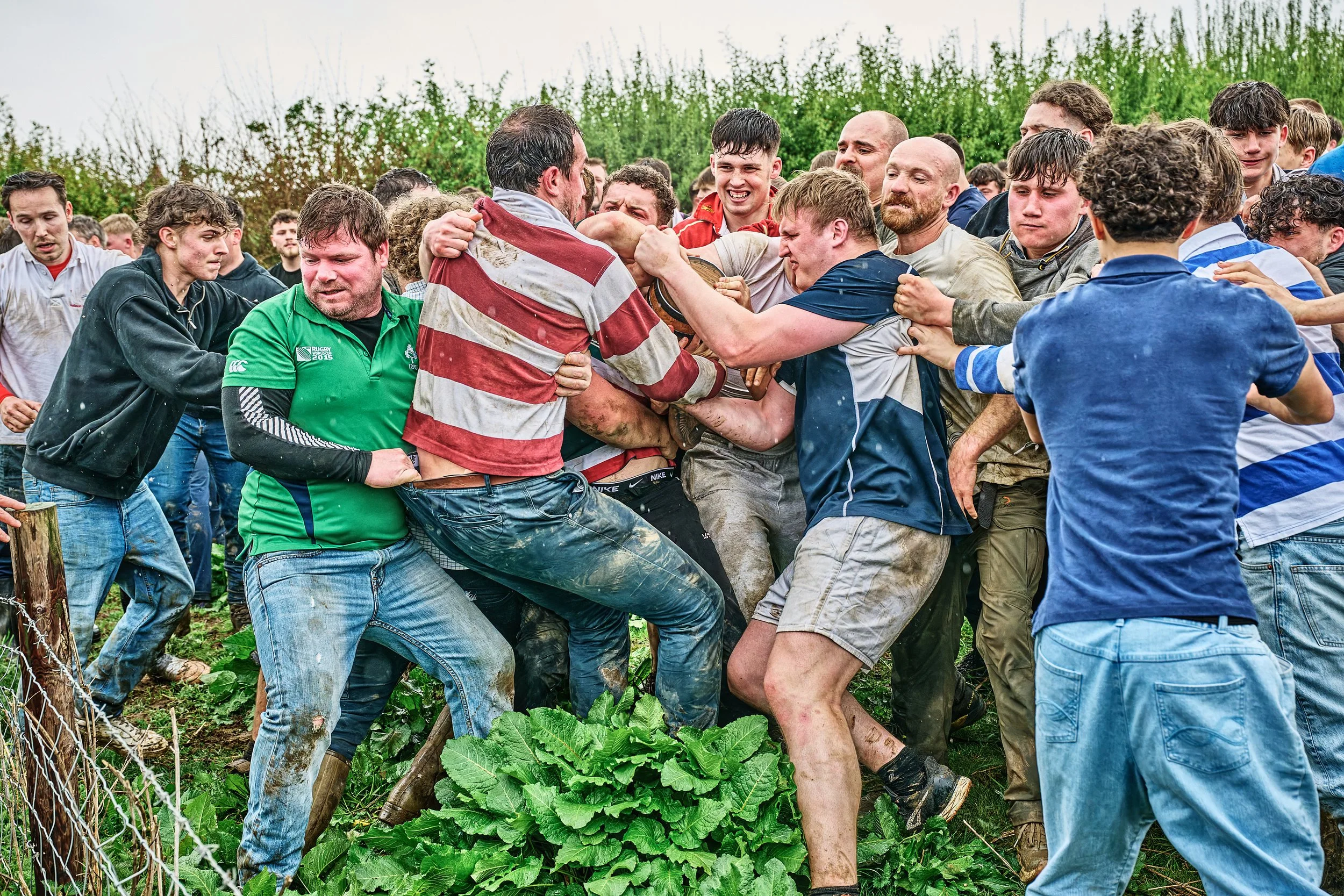 Documentary fieldwork photograph of the ancient Hare Pie and Bottle Kicking Event in Hallaton, showing the scrumage