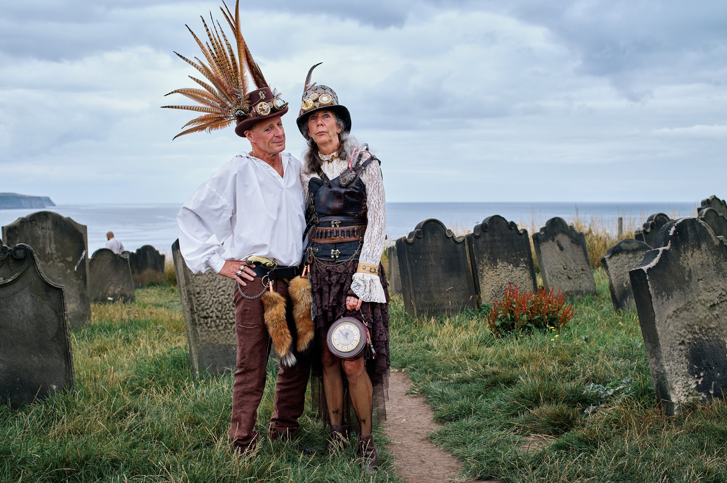 Documentary fieldwork photograph of Steampunk participants in Gothic Whitby, showing gothic St Mary's Churchyard