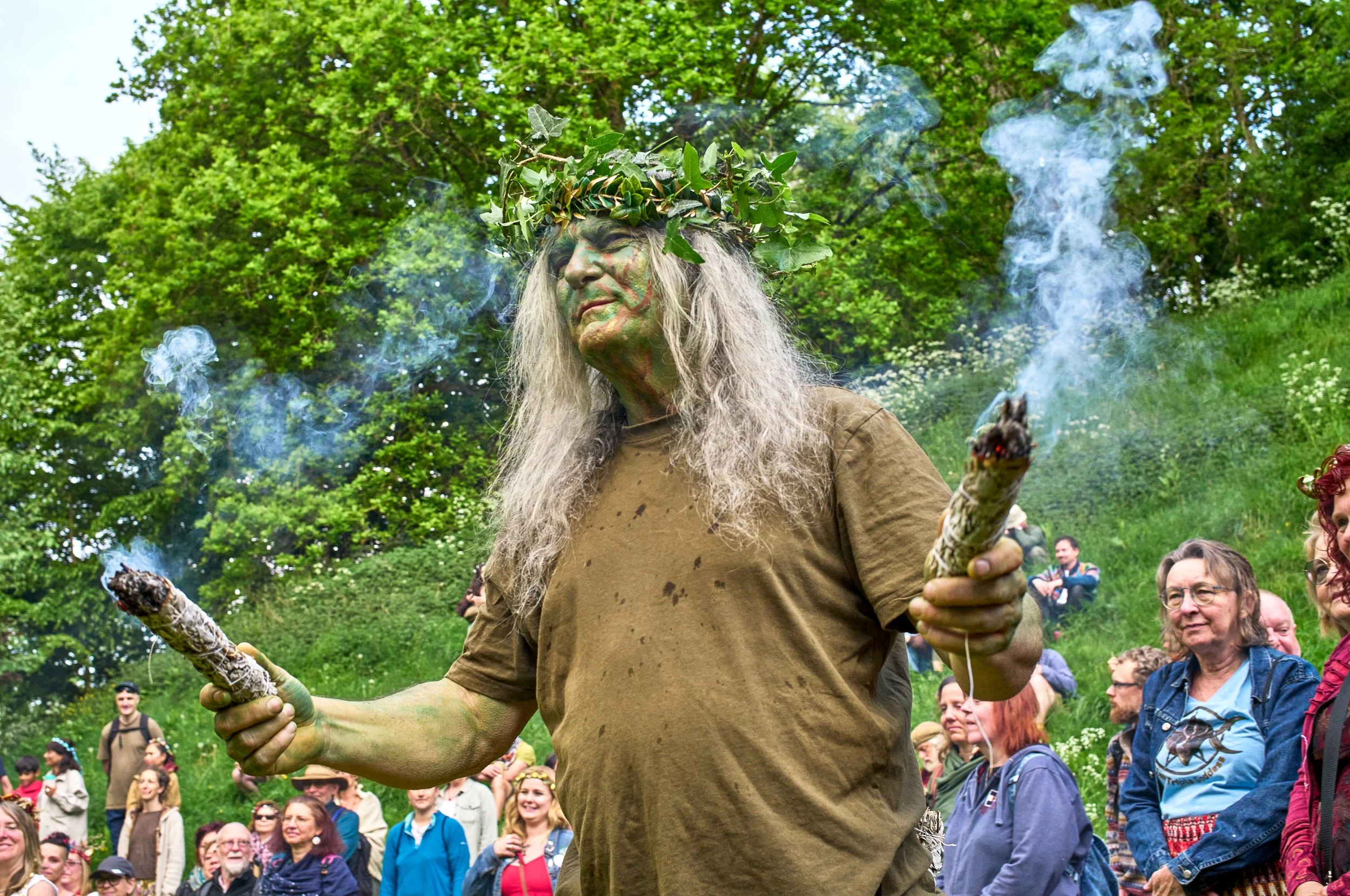 Documentary fieldwork photograph of Beltane in Glastonbury, showing the sacred Fire Keeper