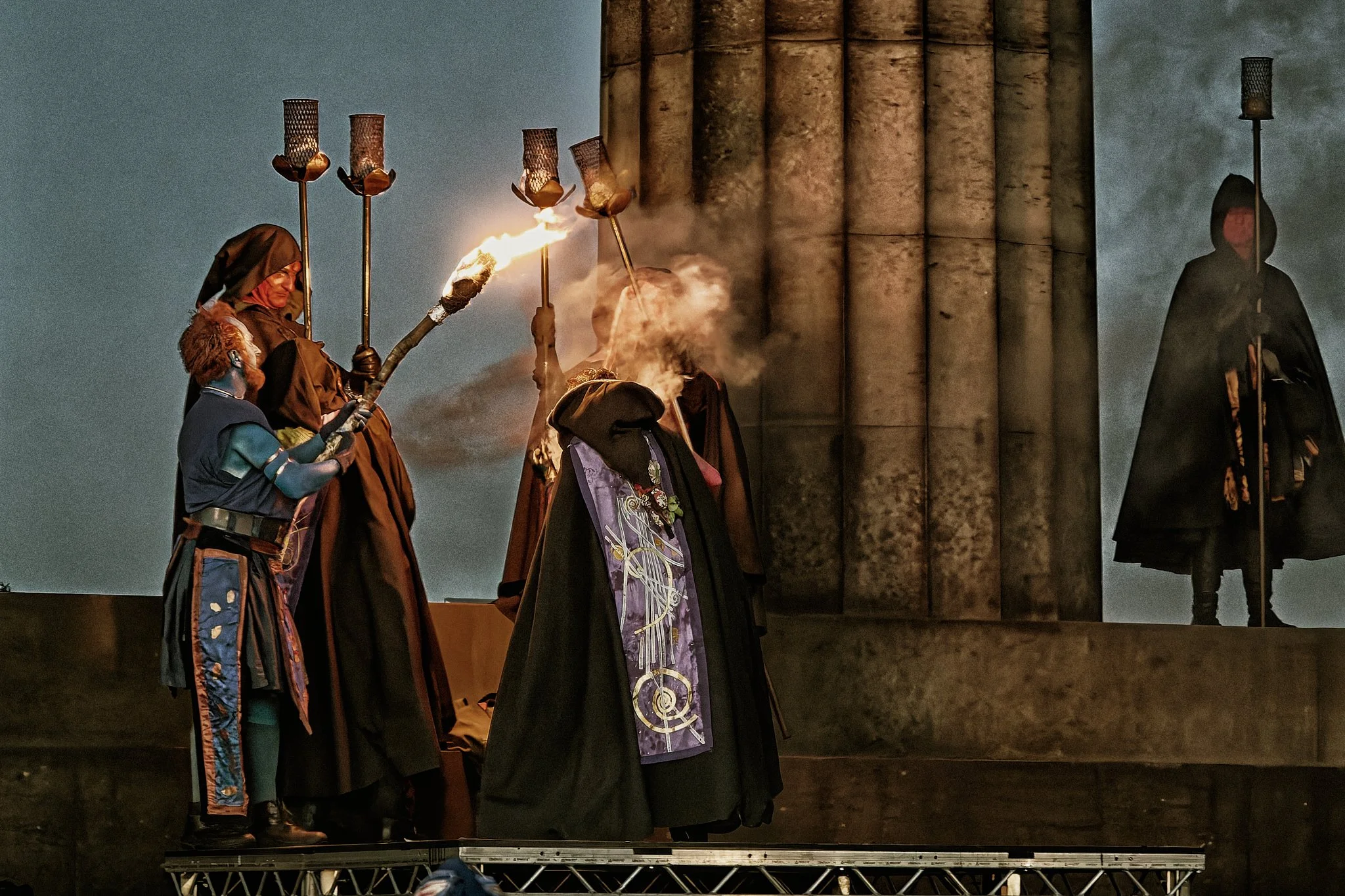 This documentary fieldwork photograph shows the first torch to be lit. No flame is taken into Beltane. This is the first fire made from friction alone. Beltane, Edinburgh 2026