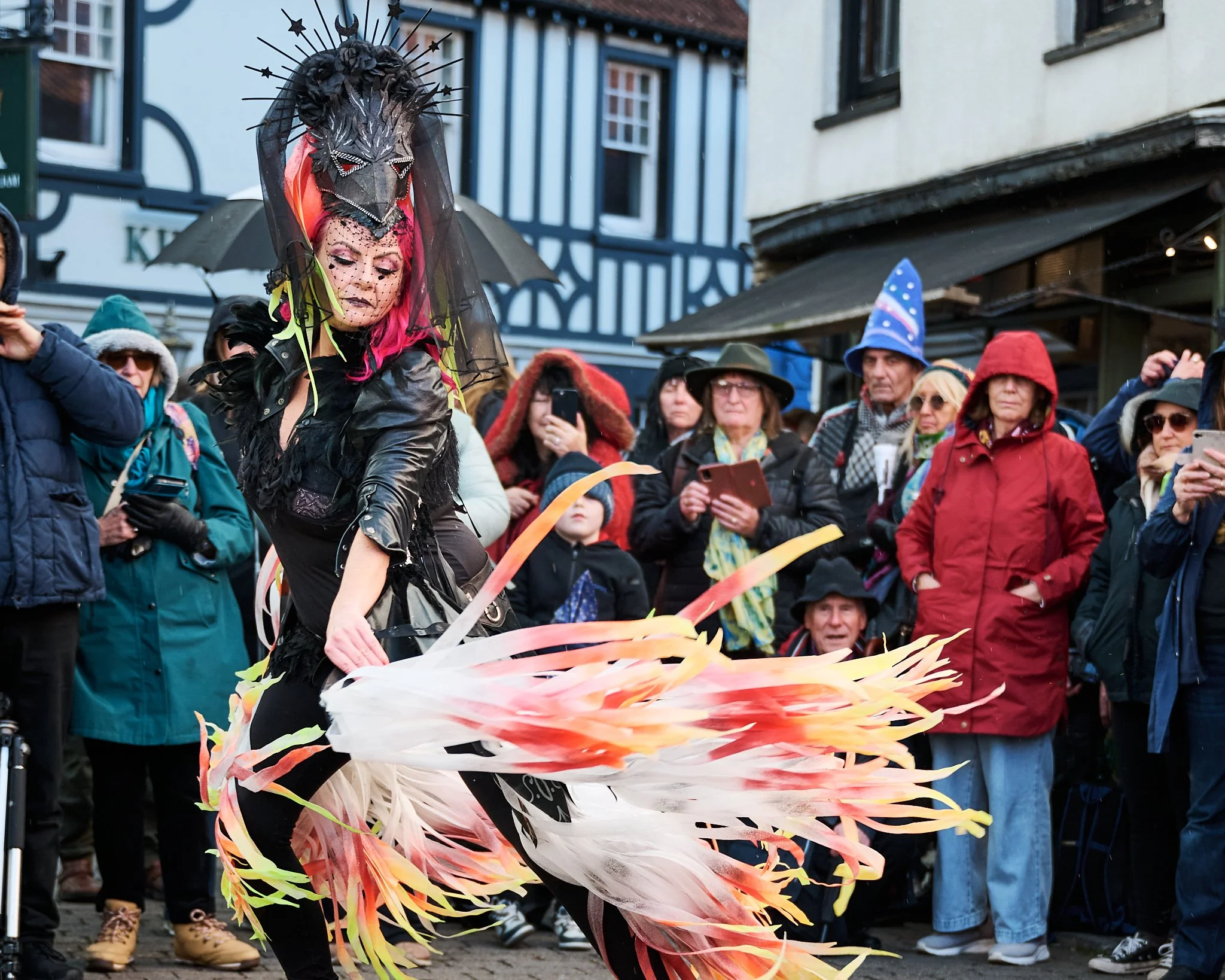 Documentary fieldwork photograph of Celtic Samhain Wild Hunt in Glastonbury, showing the Lady Amp entertaining in dance