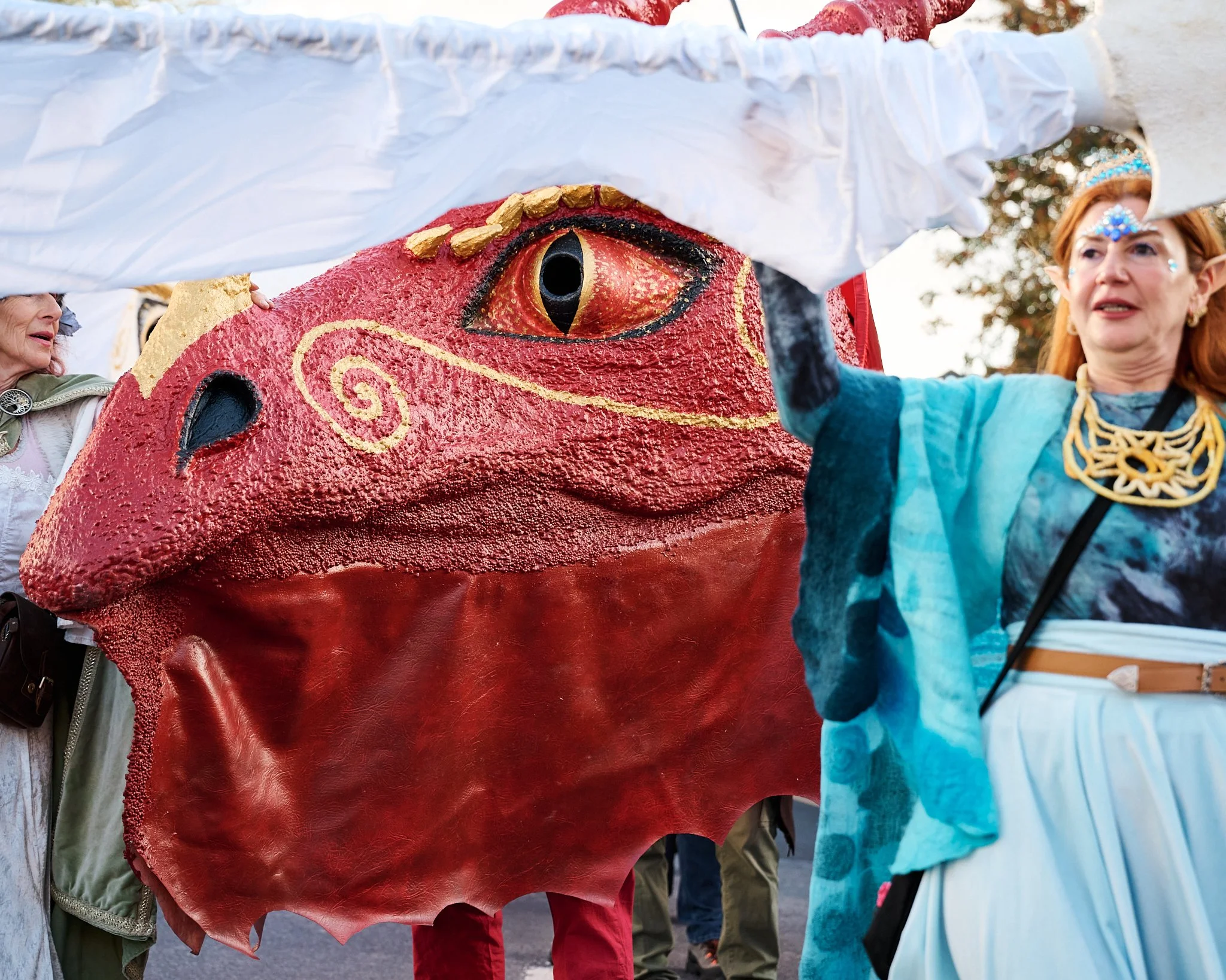 Documentary fieldwork photograph of Celtic Samhain Wild Hunt in Glastonbury, showing the Red Dragon and elf