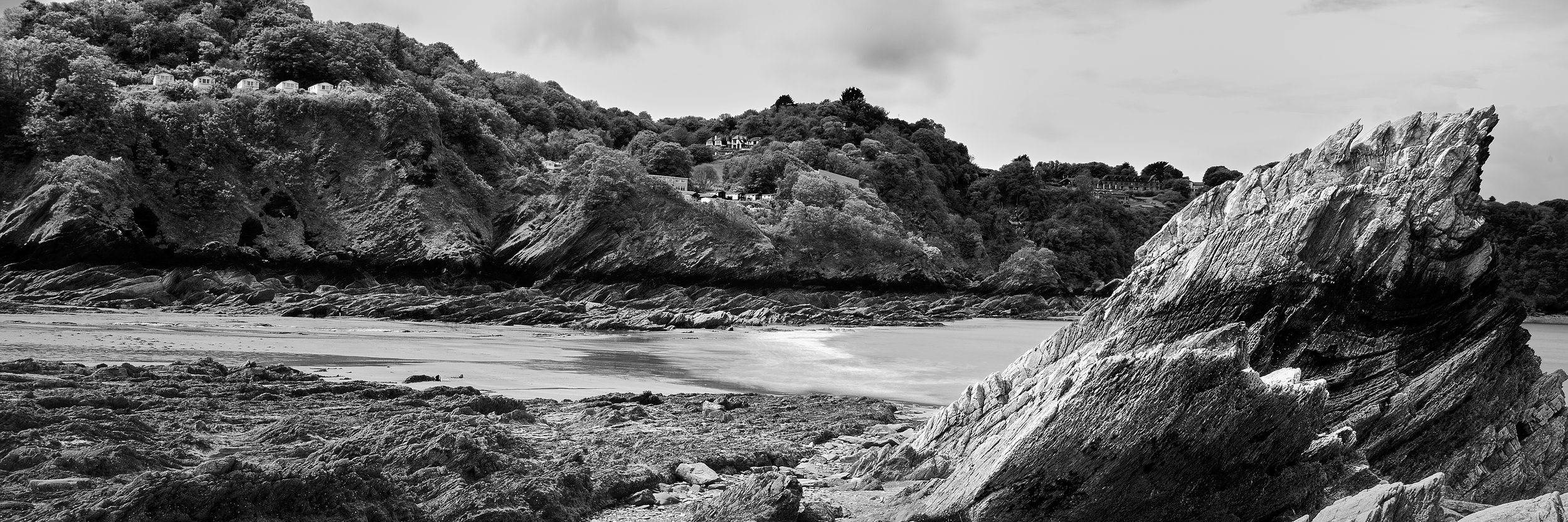 Documentary fieldwork photograph of Hunting the Earl of Rone in Coombe Martin, showing the beach metamorphic rock formations