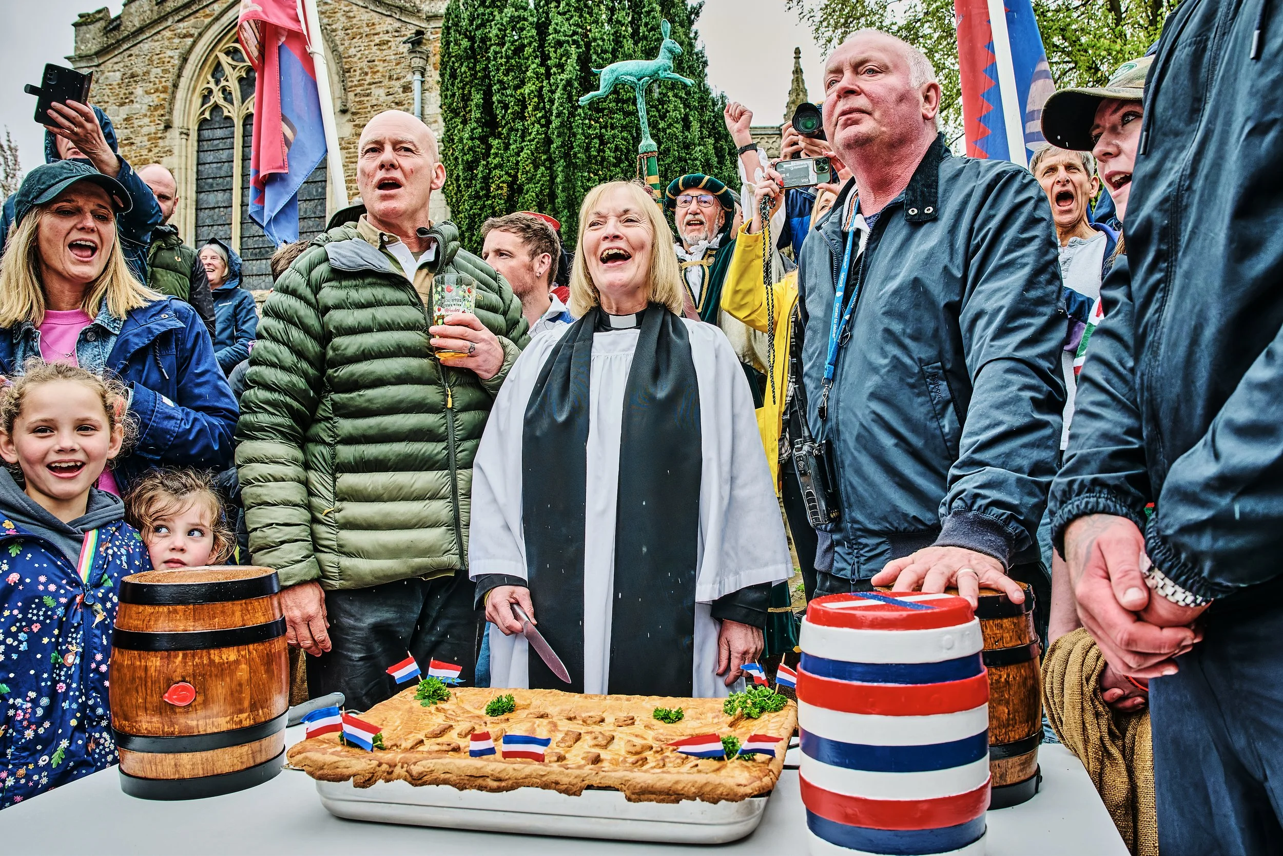 Documentary fieldwork photograph of the ancient Hare Pie and Bottle Kicking Event in Hallaton, showing blessing of the pie