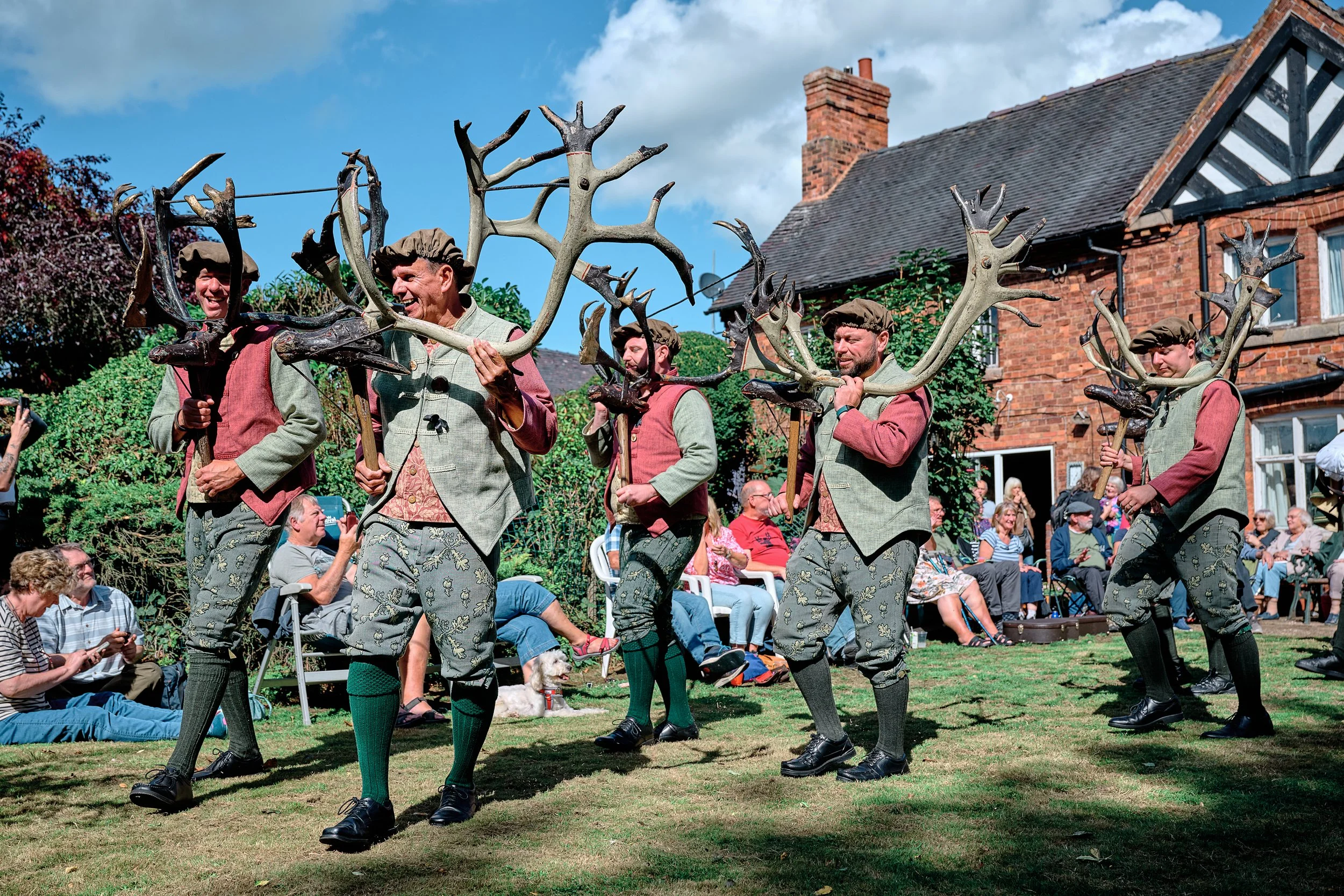 Documentary fieldwork photograph of the Horn Dance event in Abbots Bromley, showing the Little Dunstable Farm performance