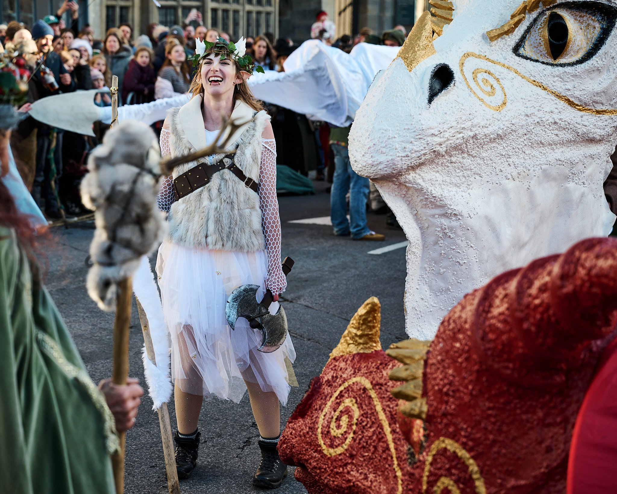Documentary fieldwork photograph of Celtic Samhain Wild Hunt in Glastonbury, showing the White Dragon's leader in victory over the Red